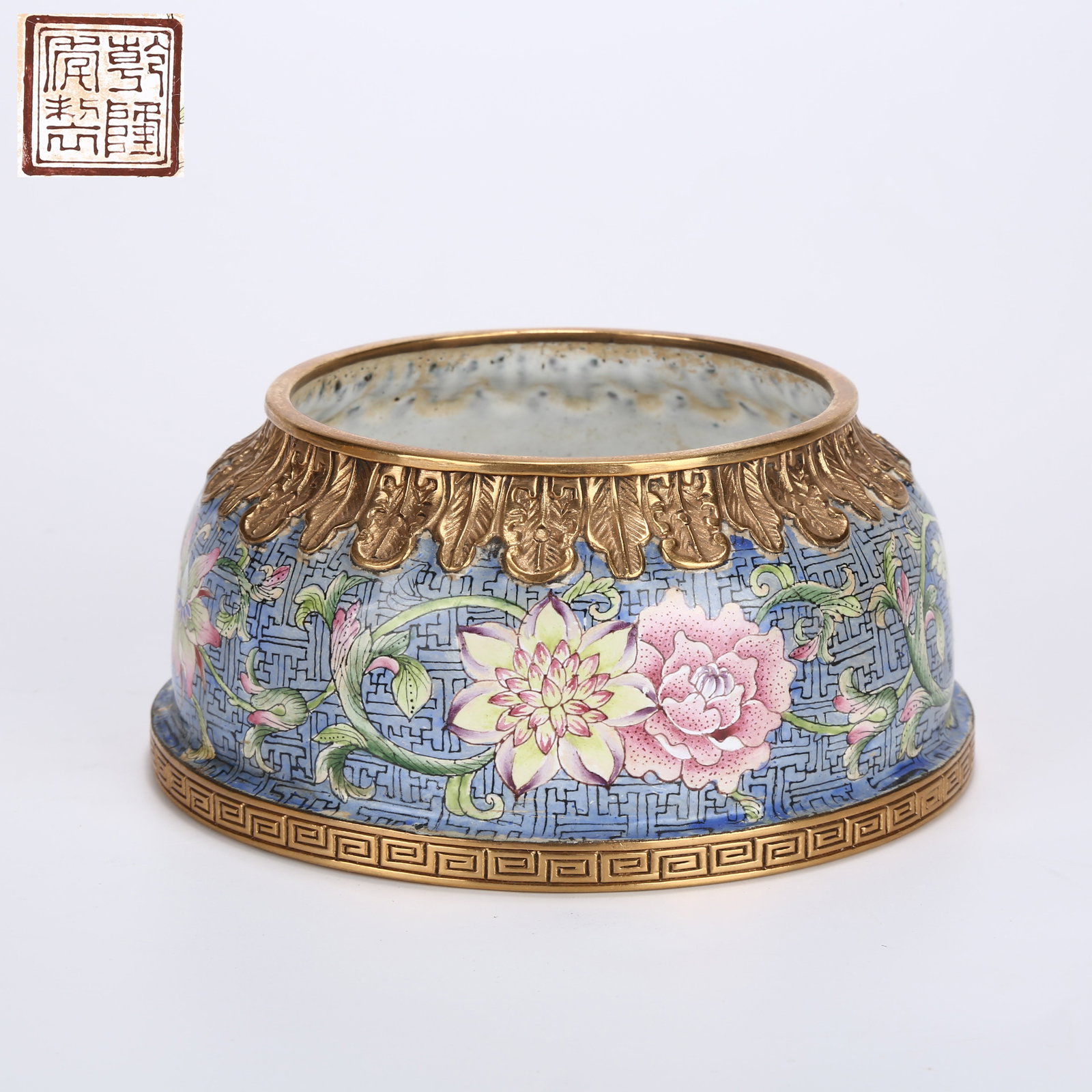 A CLOISONNÉ ENAMEL HORSE-HOOF-SHAPED VASE WITH SCROLLING FLORAL DESIGN: Cloisonné Enamel Horse-Hoof-Shaped Vase with Scrolling Floral Design