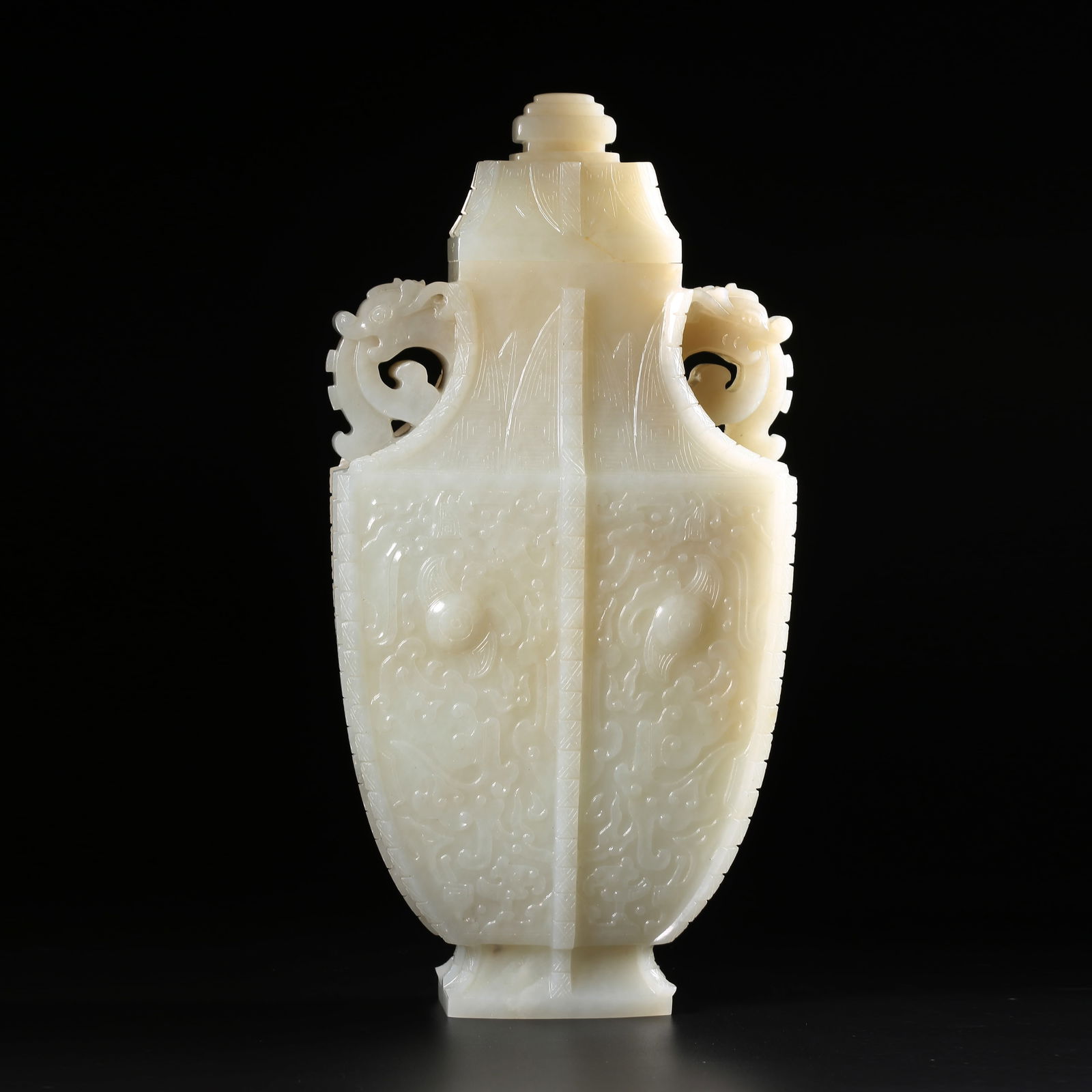 A HETIAN WHITE JADE BEAST-FACE PATTERNED EARED COVERED VASE WITH PROTRUDING BLADE (1 of 9)