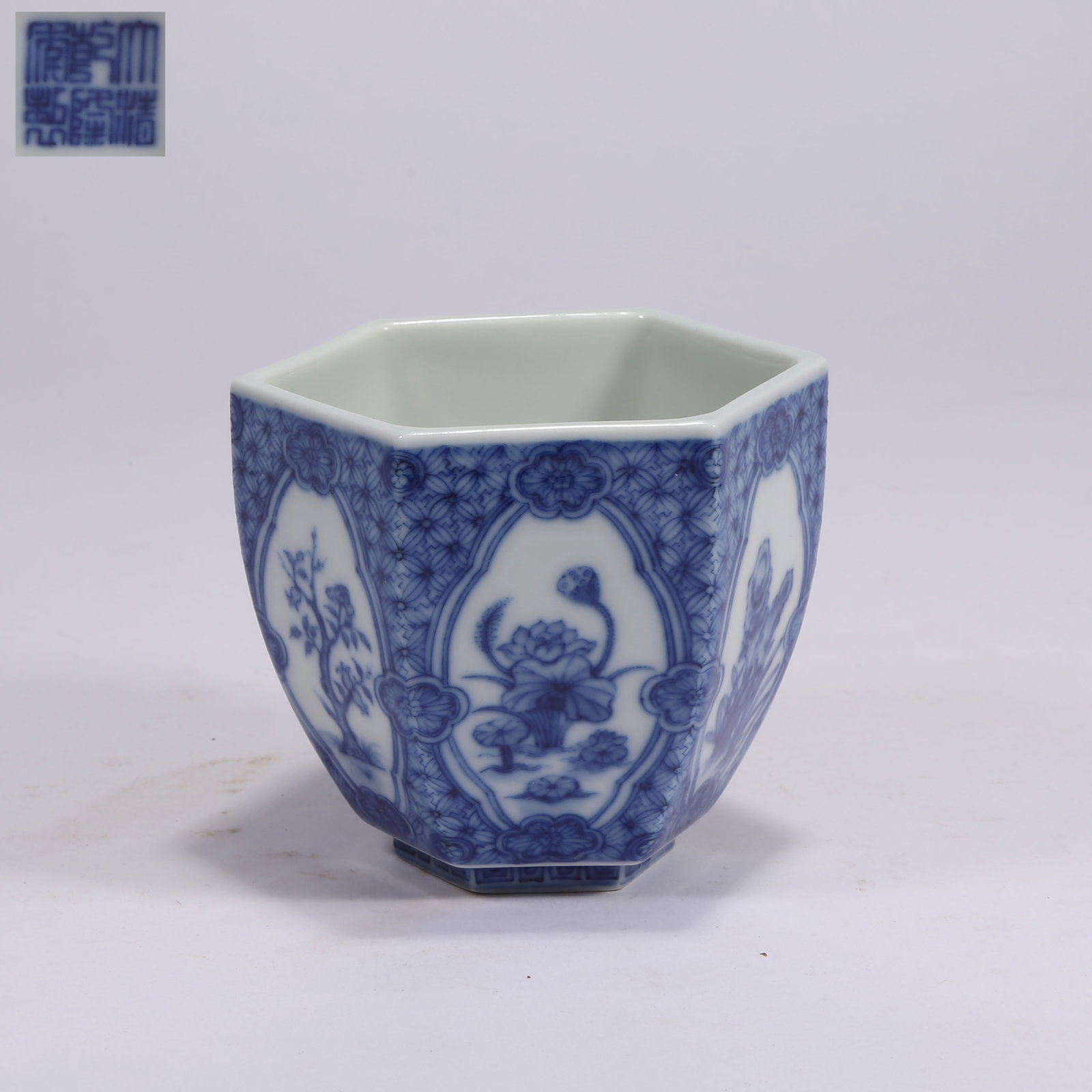 A BLUE-AND-WHITE SIX-SIDED CUP WITH OPENWORK ROCK AND FLOWER MOTIFS (1 of 9)