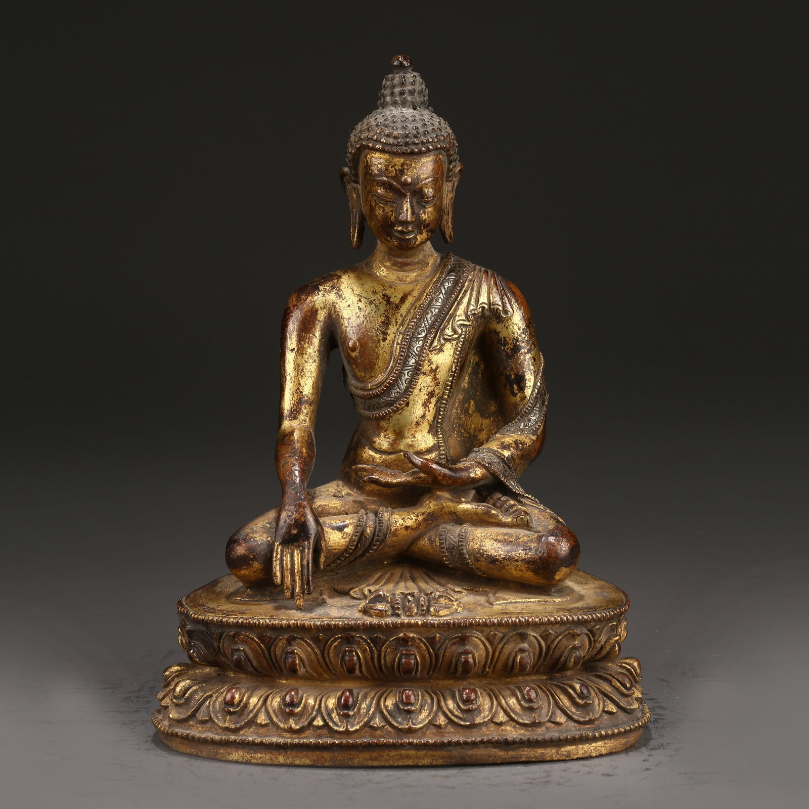A GILT BRONZE STATUE OF AKSHOBHYA BUDDHA (1 of 9)