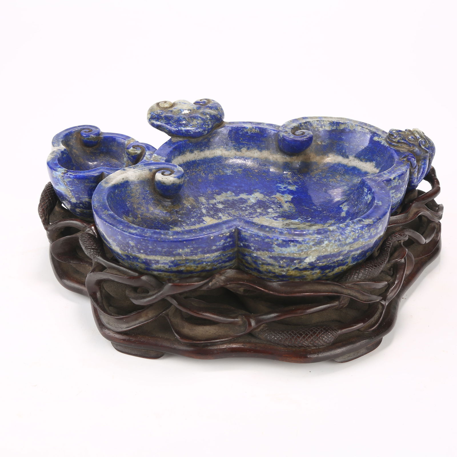 A LAPIS LAZULI PETAL-SHAPED WASHER WITH CHI DRAGON PATTERN: Lapis Lazuli Petal-Shaped Washer with Chi Dragon Pattern