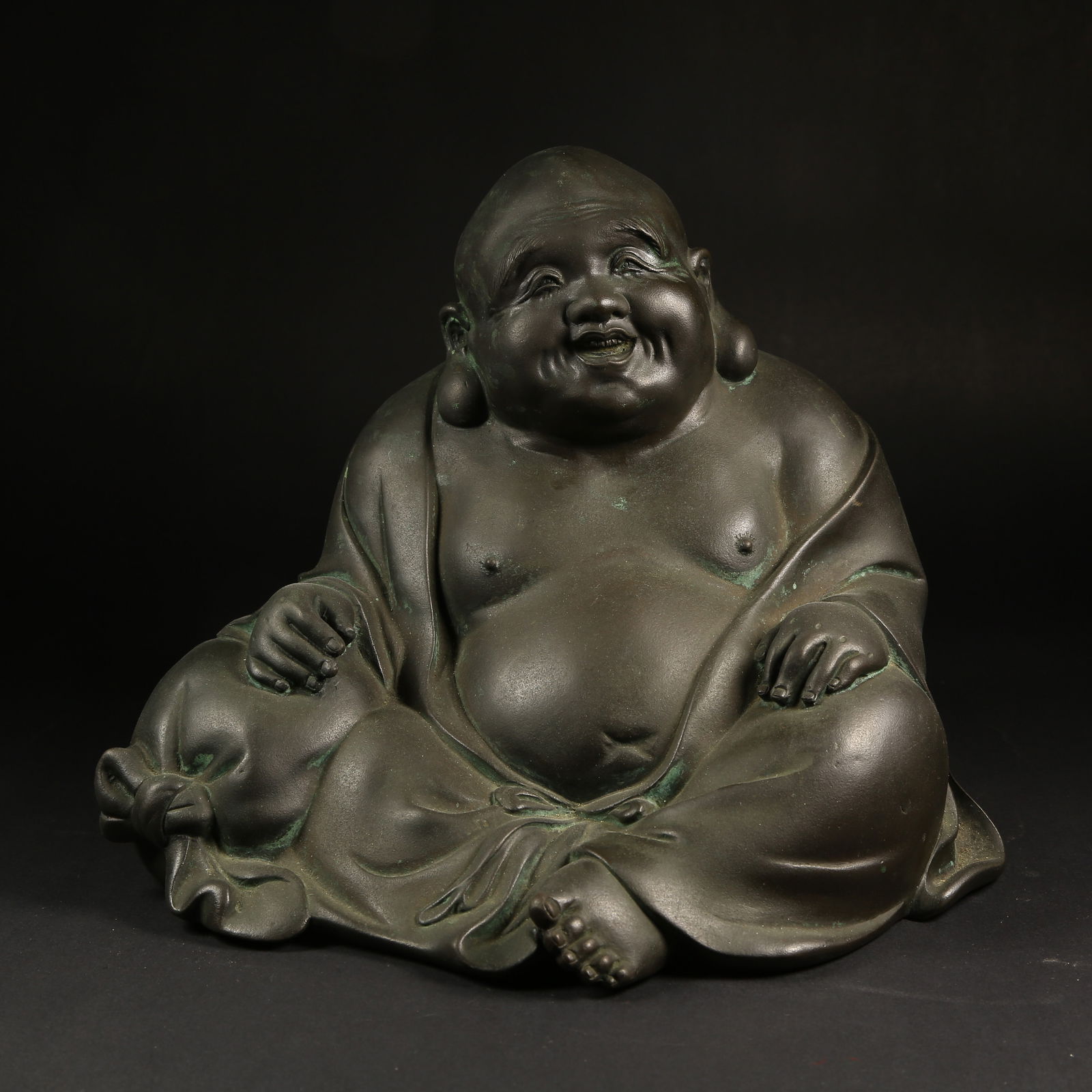 A BRONZE BUDAI (LAUGHING MONK) STATUE (1 of 9)