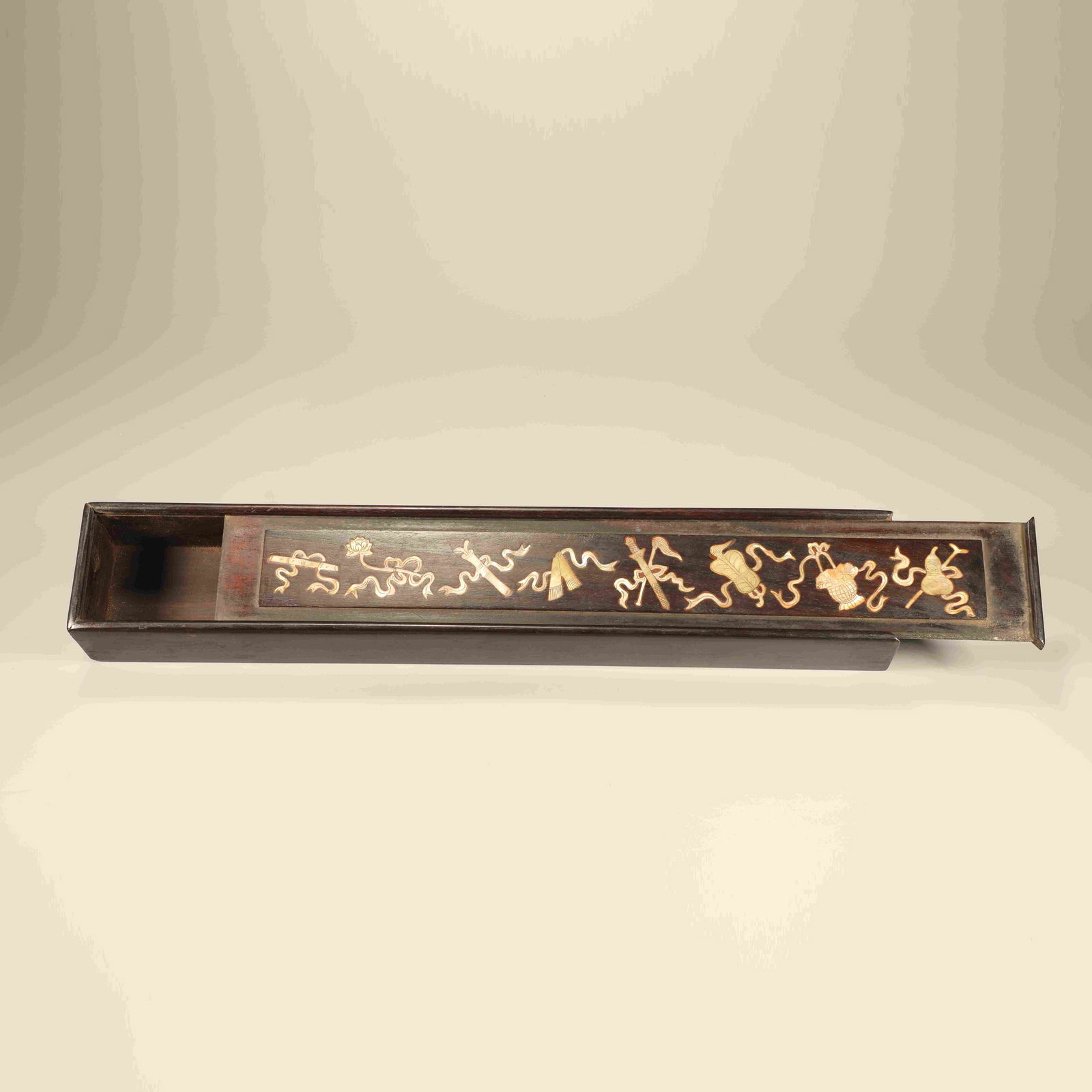A ZITAN WOOD LONG BOX INLAID WITH MOTHER-OF-PEARL, DECORATED WITH THE EIGHT AUSPICIOUS EMBLEMS (1 of 6)