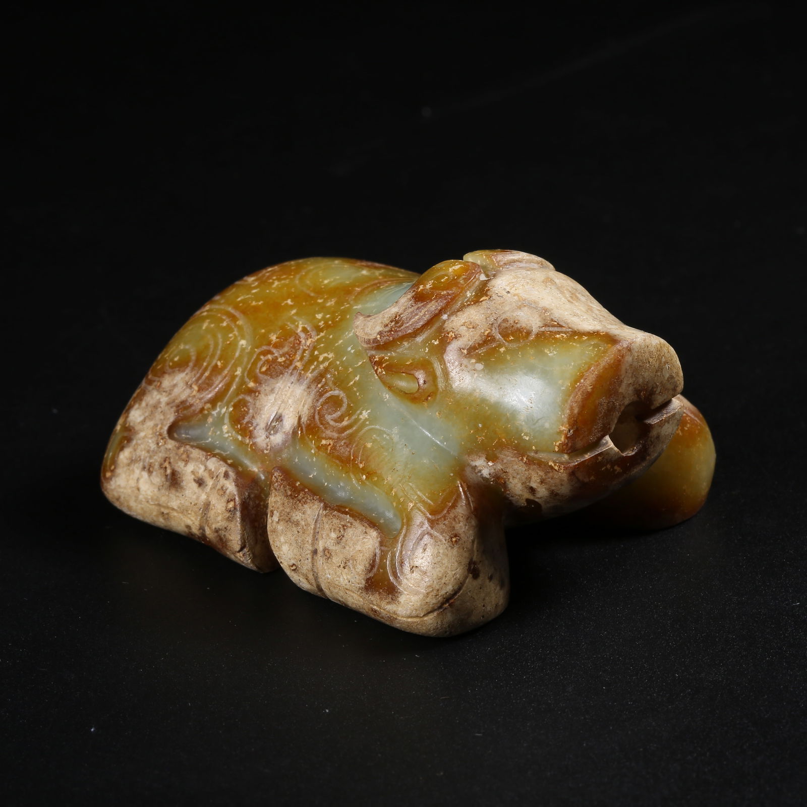 A ARCHAIC JADE DIVINE OX FIGURINE (1 of 8)