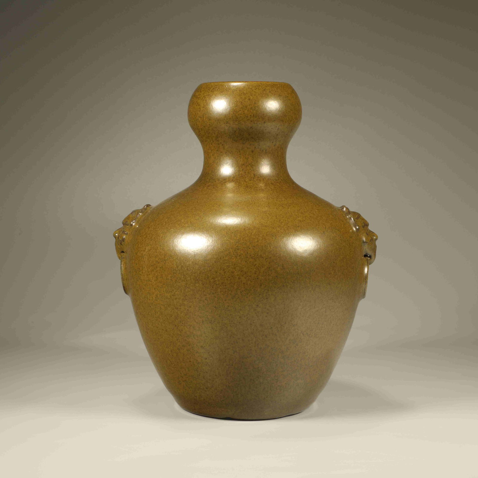 A TEA-DUST GLAZED VASE WITH MASK HANDLES (1 of 6)