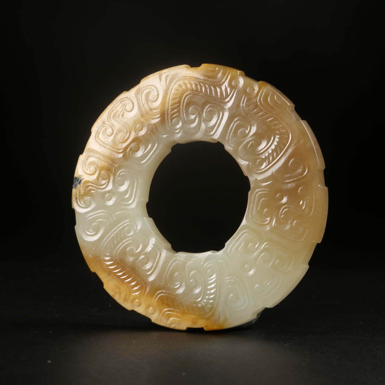 A ARCHAIC JADE BI-RING WITH BEAST-FACE MOTIF (1 of 10)