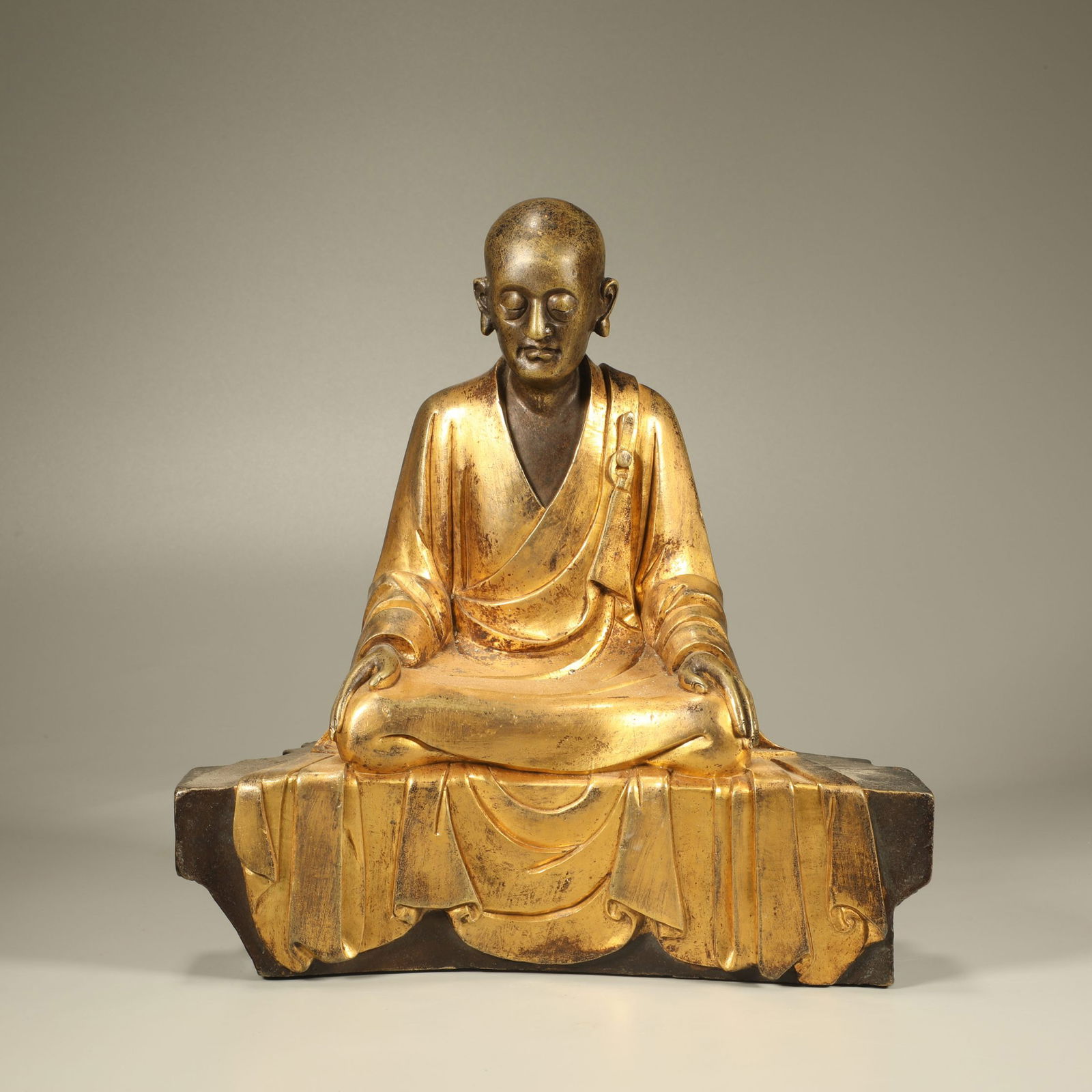 A GILT-BRONZE FIGURE OF AN ARHAT (1 of 6)