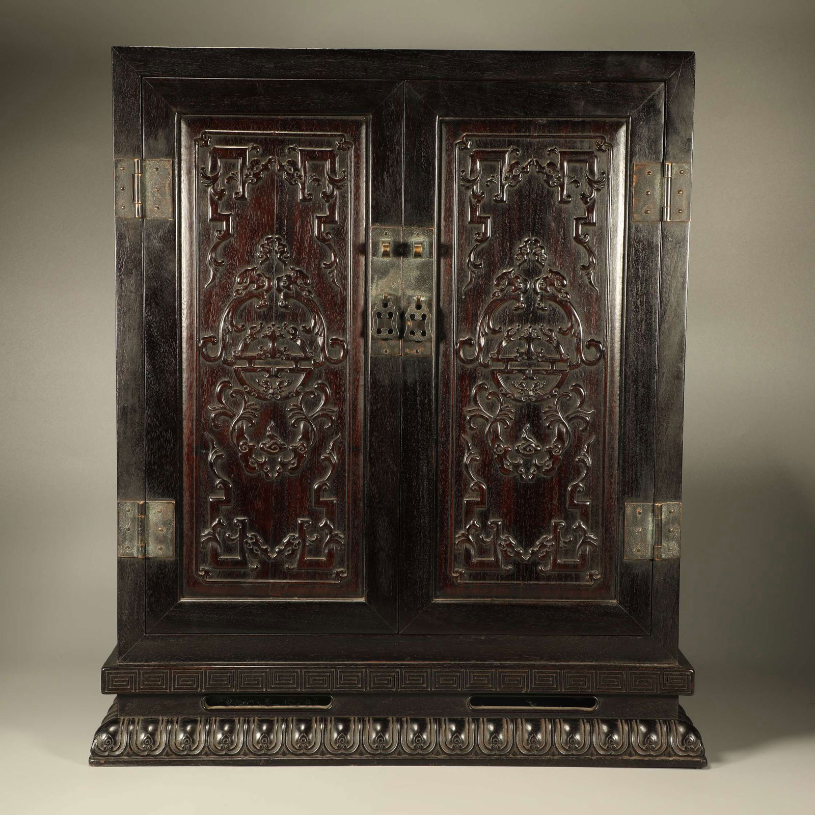 A ZITAN WOOD BUDDHIST CABINET CARVED WITH DRAGON MOTIFS (1 of 6)