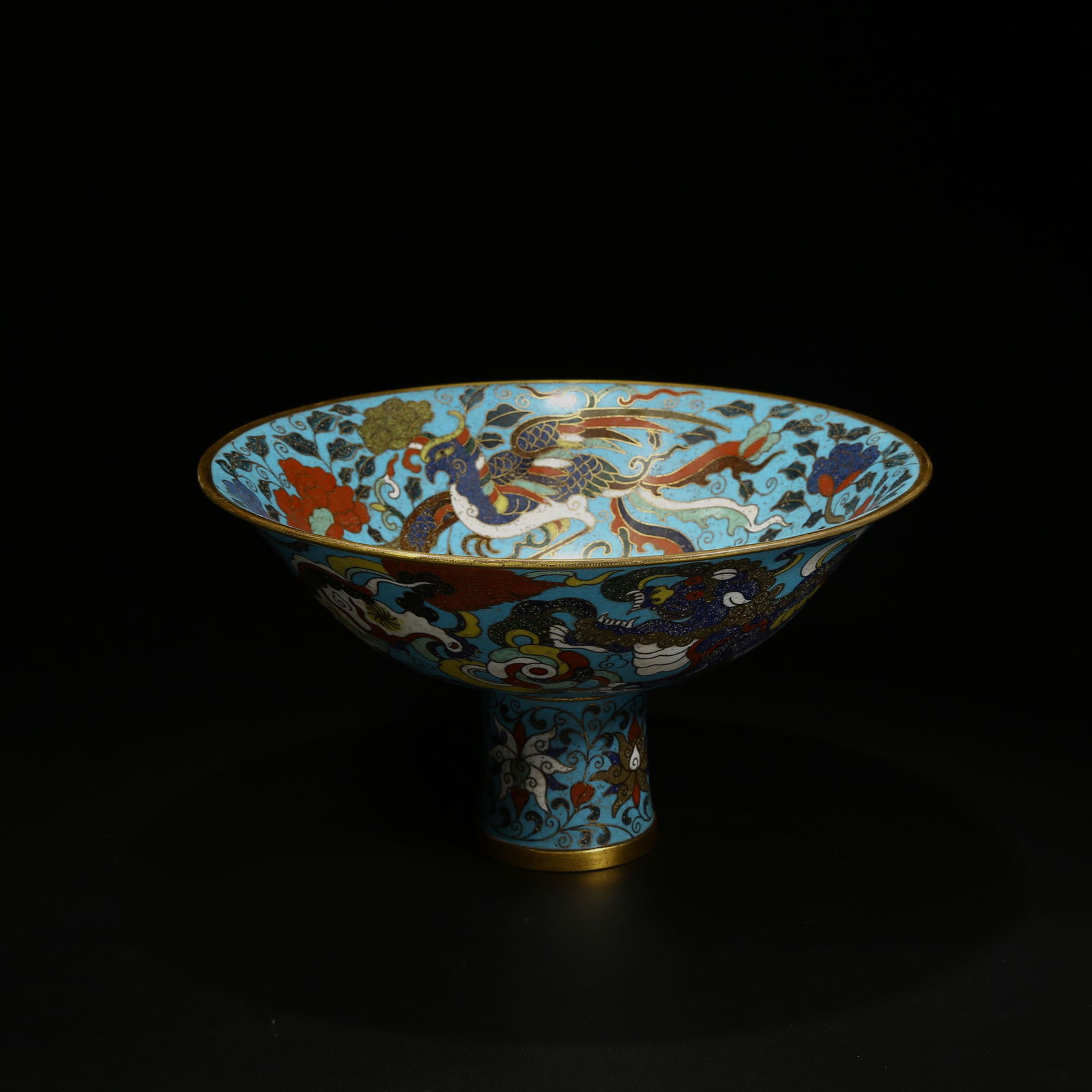 A BRONZE CLOISONNÉ ENAMEL HIGH-FOOTED BOWL WITH INTERTWINED DRAGON AND PHOENIX PATTERN: Bronze Cloisonné Enamel High-Footed Bowl with Intertwined Dragon and Phoenix Pattern
