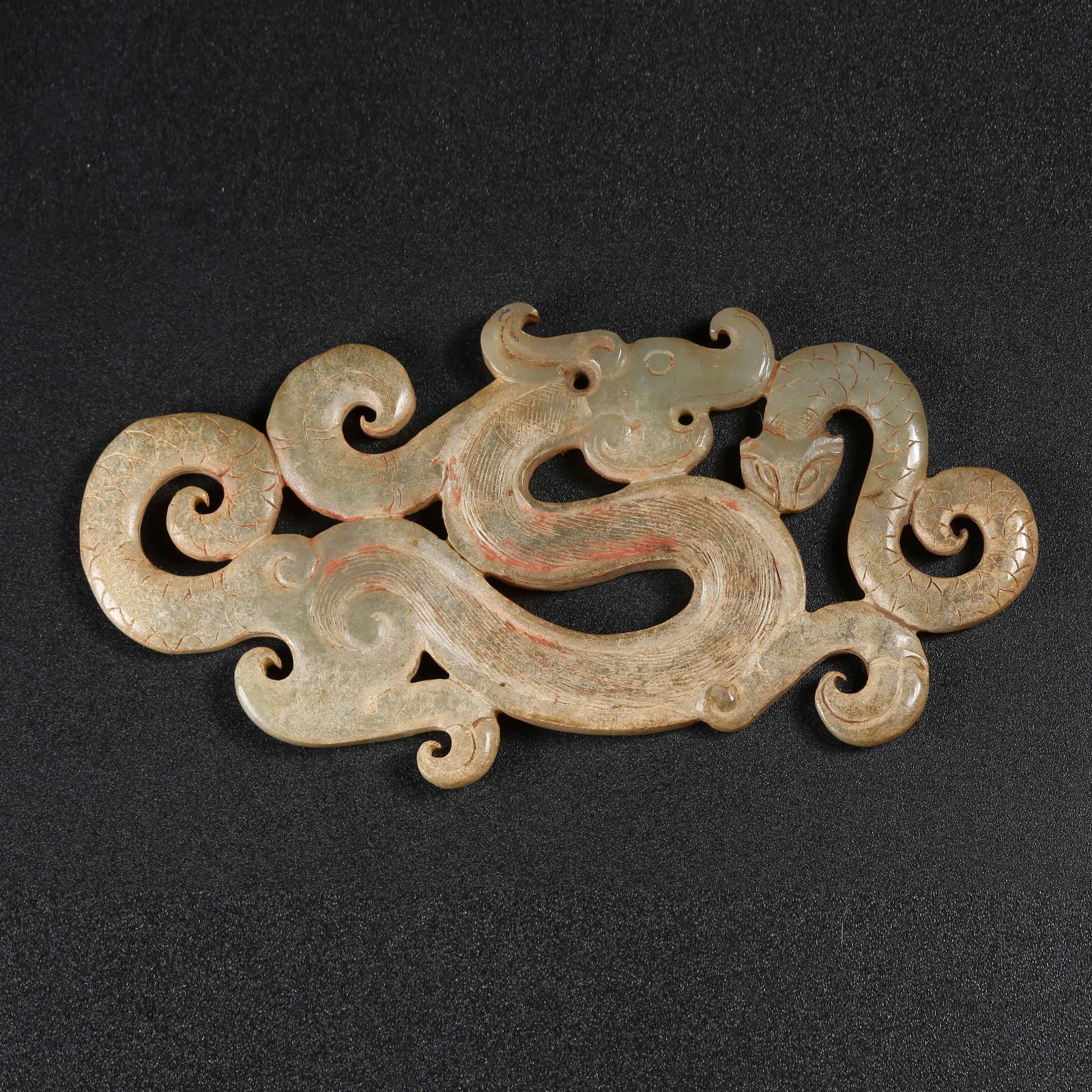 A MEDIEVAL JADE DRAGON PENDANT (1 of 8)