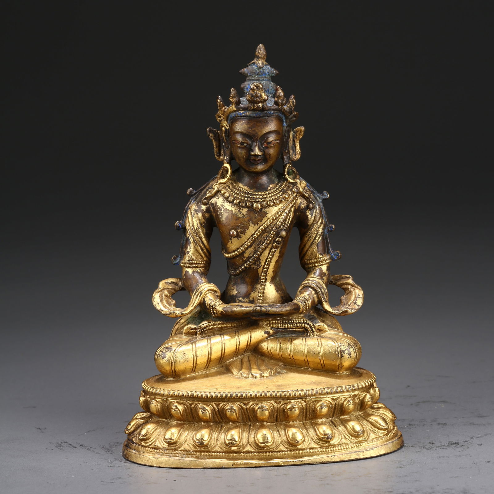 A GILT BRONZE STATUE OF AMITAYUS (BUDDHA OF INFINITE LIFE): Gilt Bronze Statue of Amitayus (Buddha of Infinite Life)