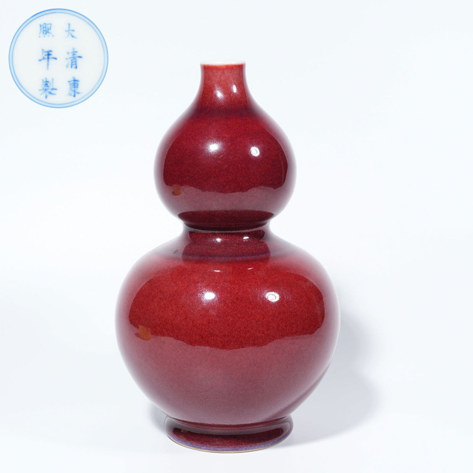 A RED-GLAZED GOURD-SHAPED VASE (1 of 9)