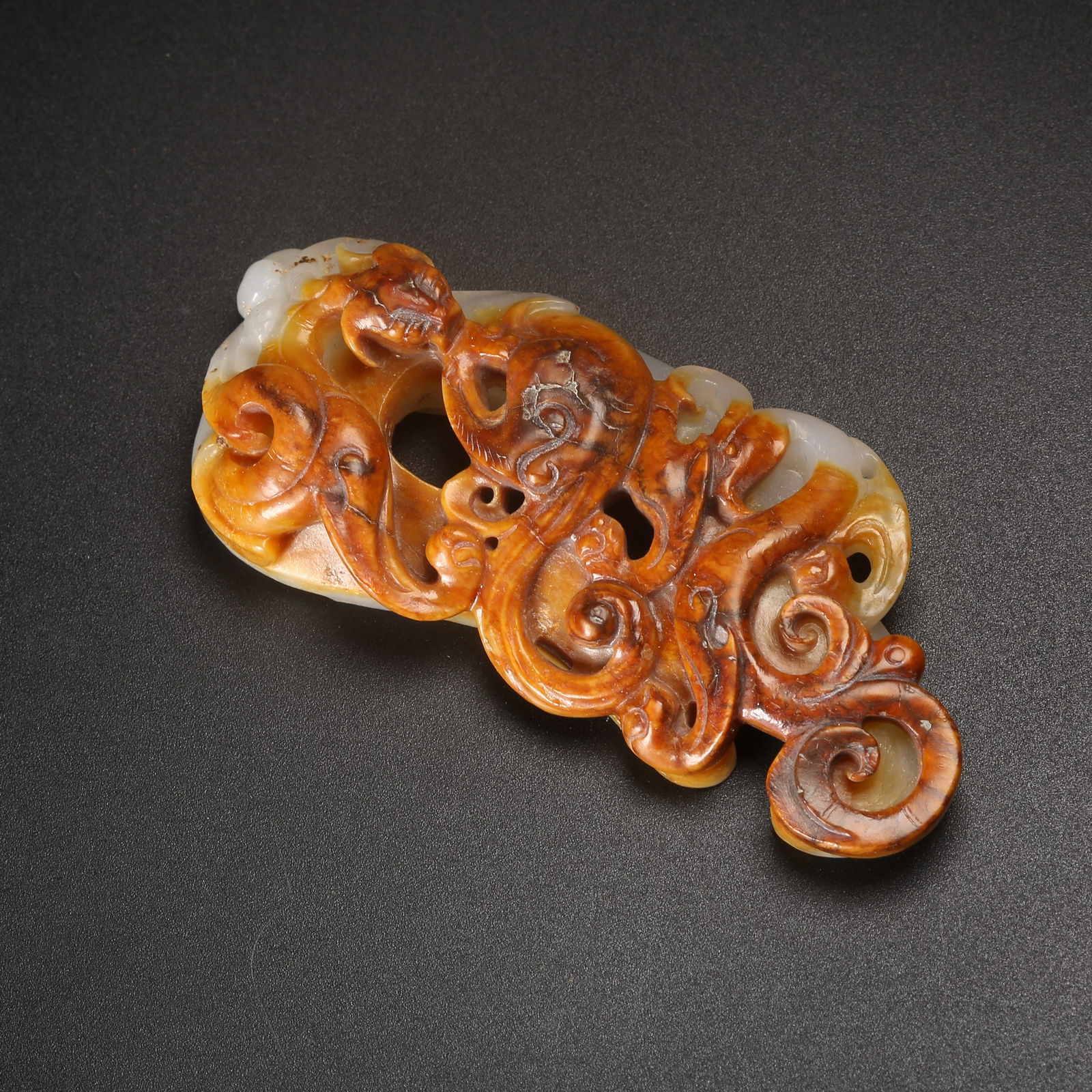 A ARCHAIC JADE CHICKEN-HEART PENDANT WITH CHI-DRAGON MOTIF (1 of 10)