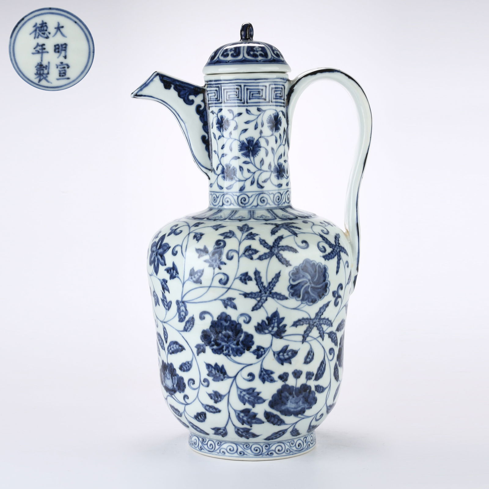 A BLUE AND WHITE LARGE EWER WITH SCROLLING FLORAL DESIGN: Blue and White Large Ewer with Scrolling Floral Design