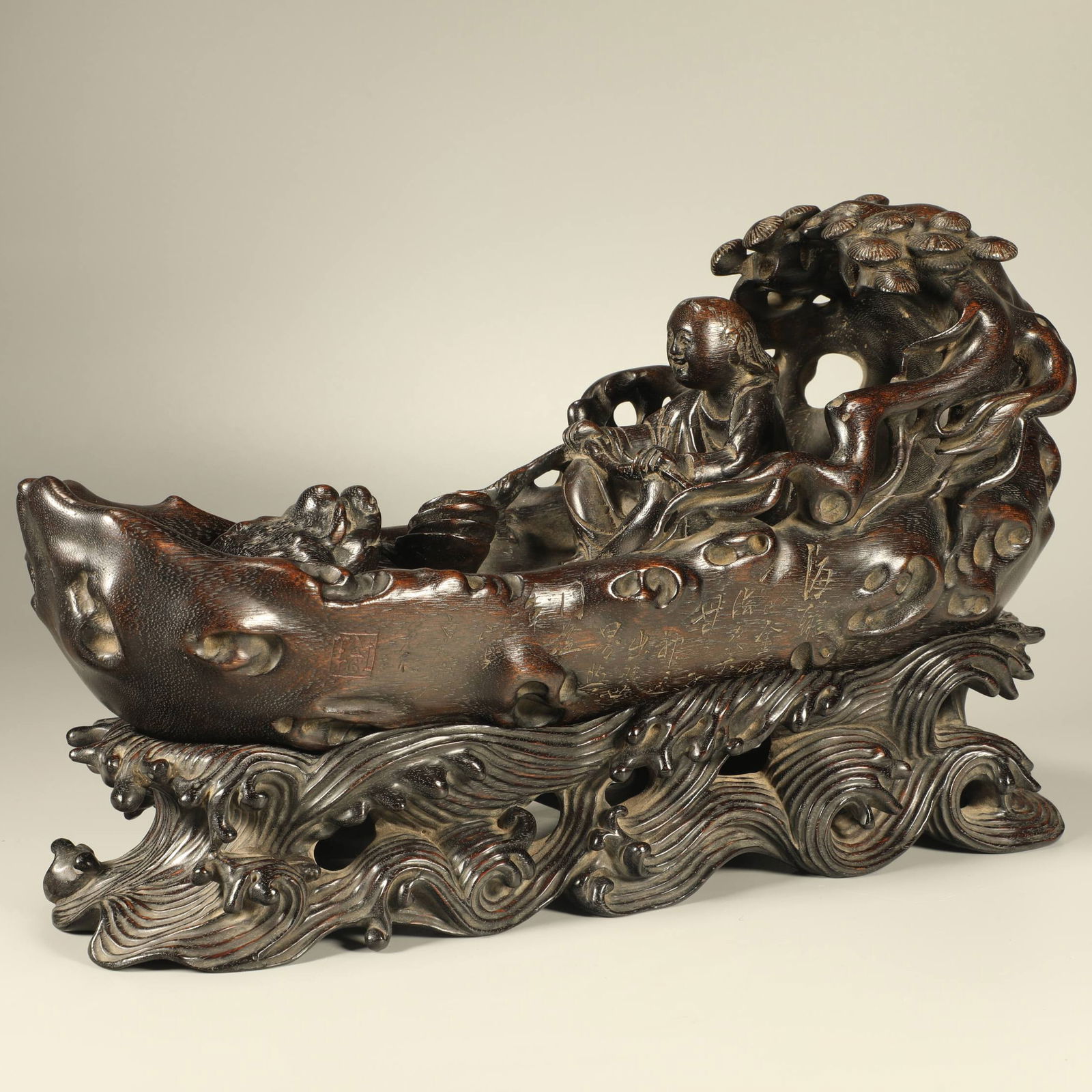 A AGARWOOD CARVING OF LIU HAI PLAYING WITH THE GOLDEN TOAD: Agarwood carving of Liu Hai playing with the Golden Toad