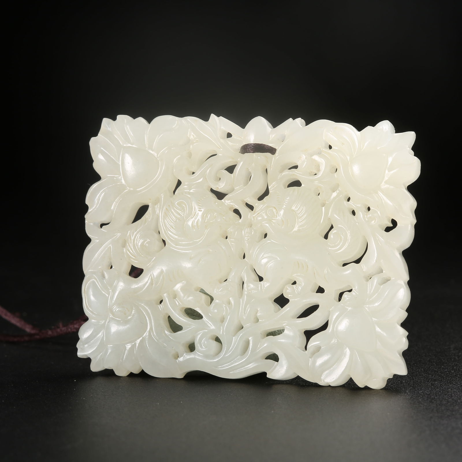 A HETIAN JADE PENDANT WITH AUSPICIOUS BEAST MOTIF (1 of 8)