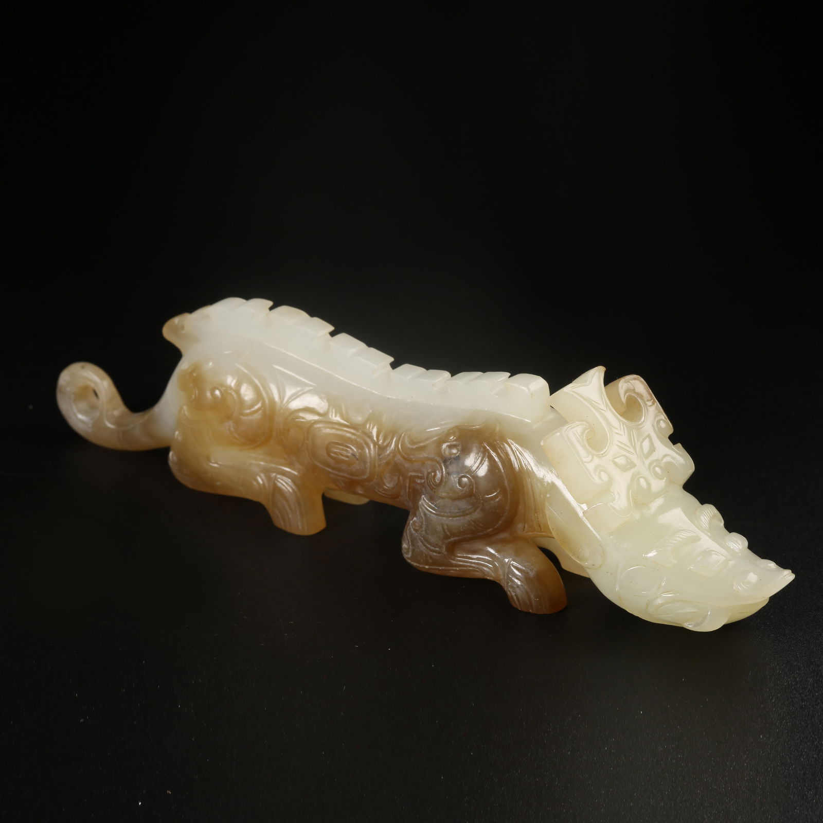 A ARCHAIC JADE AUSPICIOUS BEAST ORNAMENT (1 of 8)