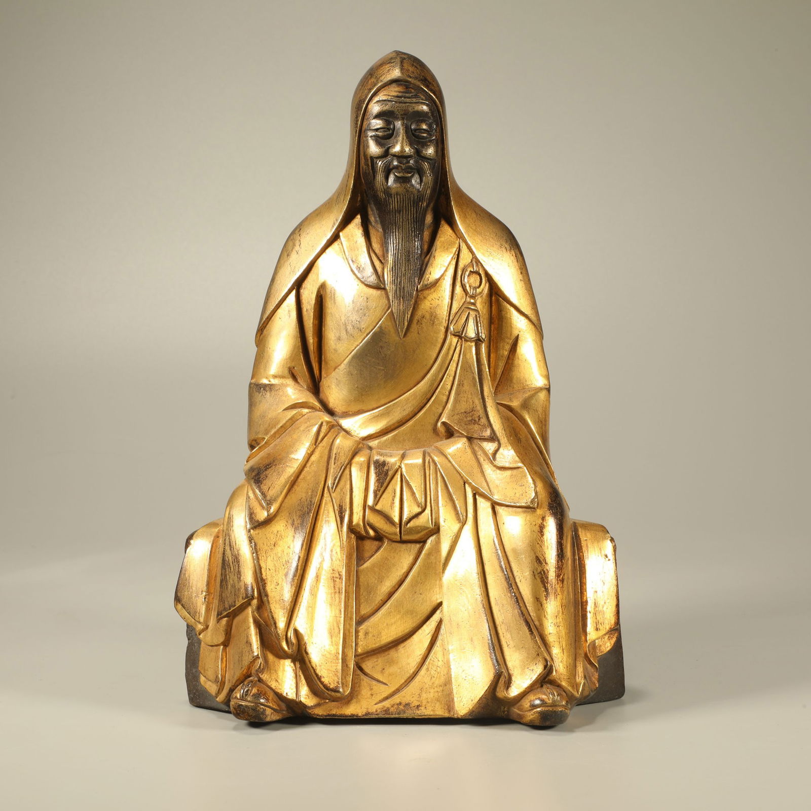 A GILT-BRONZE FIGURE OF A HIGH-RANKING SCHOLAR: Gilt-bronze figure of a high-ranking scholar