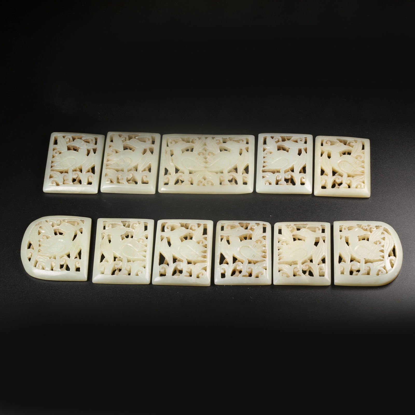A GROUP OF HETIAN JADE BELT PLAQUES CARVED WITH AUSPICIOUS BEAST MOTIFS (1 of 8)