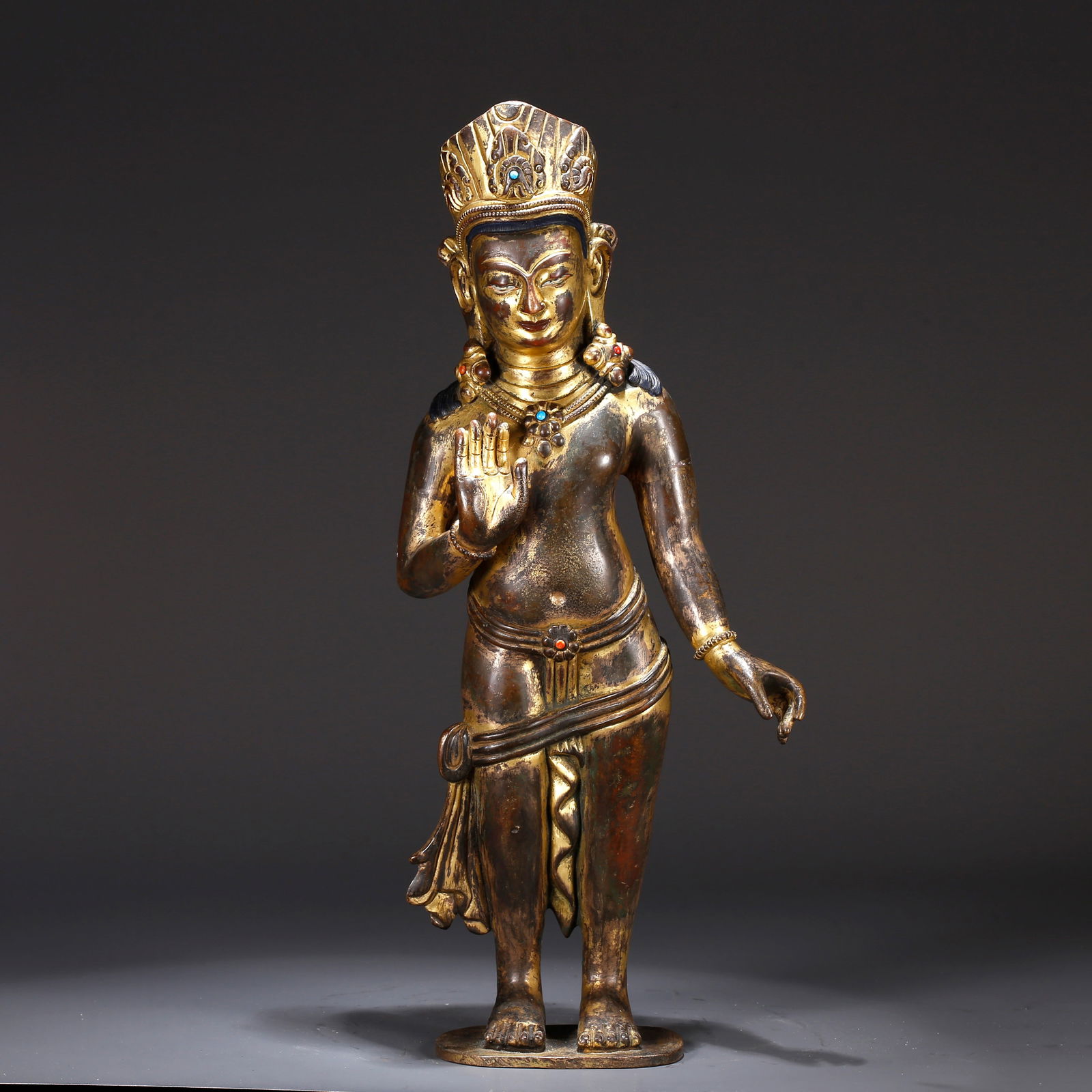 A GILT BRONZE STATUE OF CROWNED SHAKYAMUNI (1 of 11)