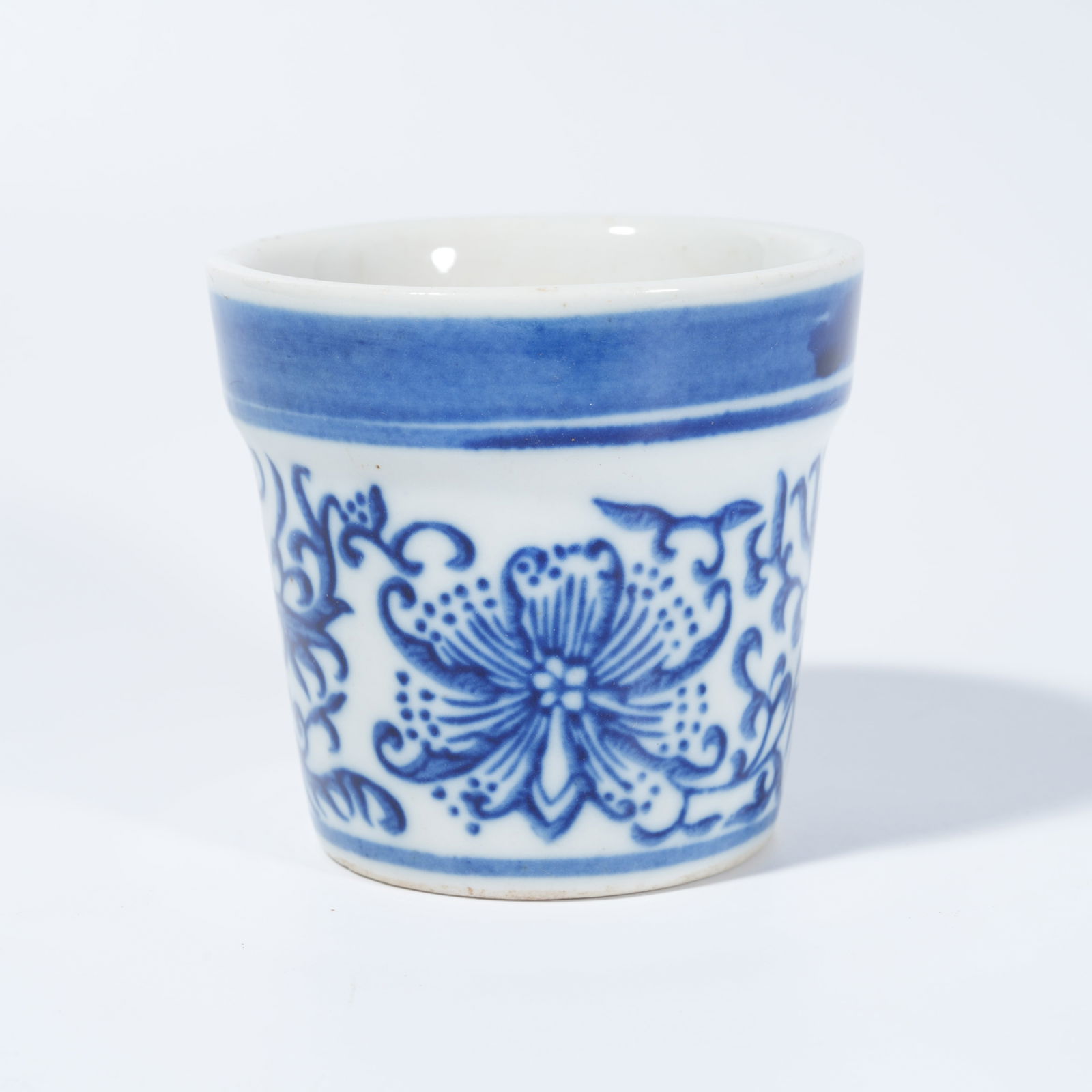 A BLUE-AND-WHITE FLOWERPOT WITH SCROLLING FLORAL DECORATION (1 of 9)