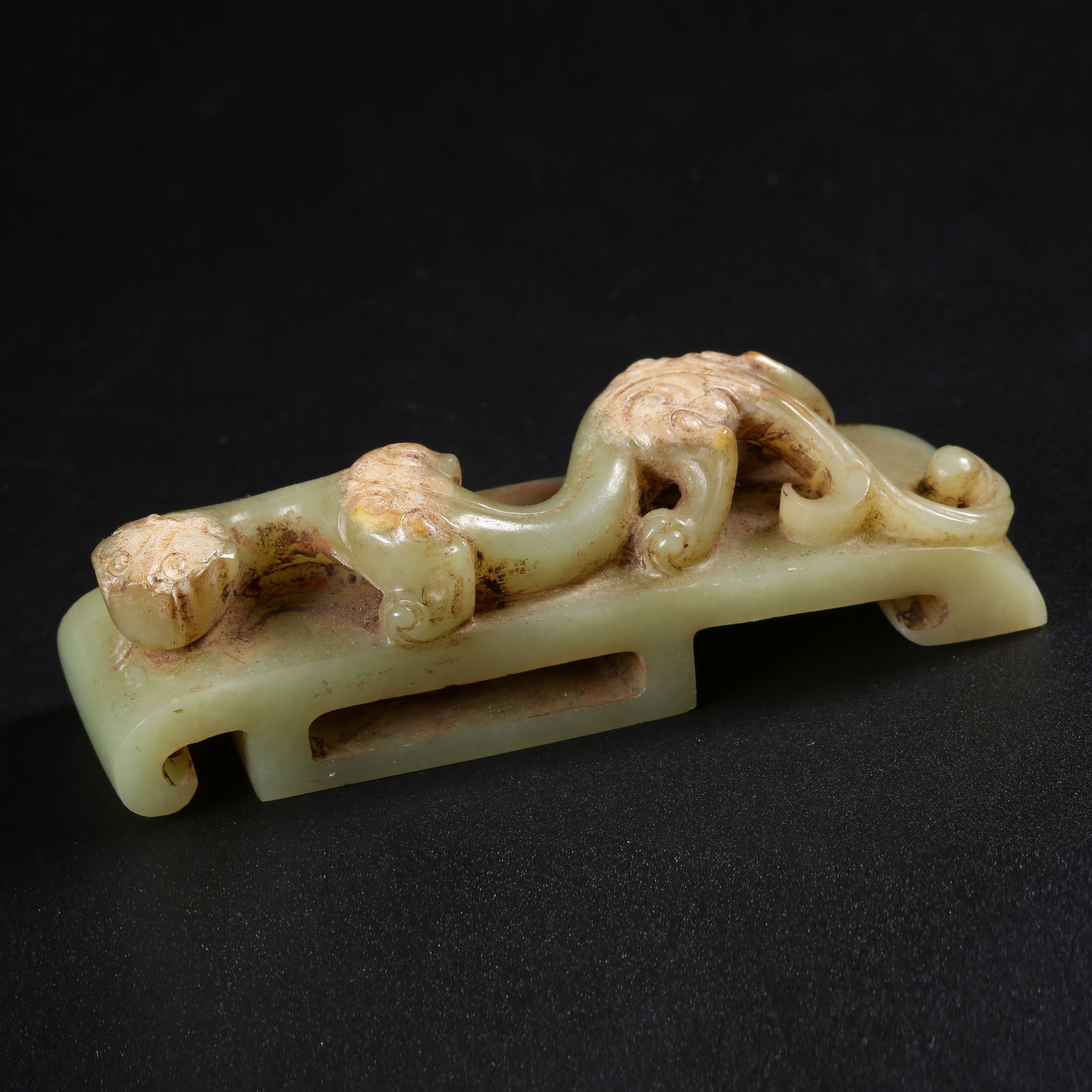 A ARCHAIC JADE SWORD HILT WITH CHI-DRAGON MOTIF (1 of 7)