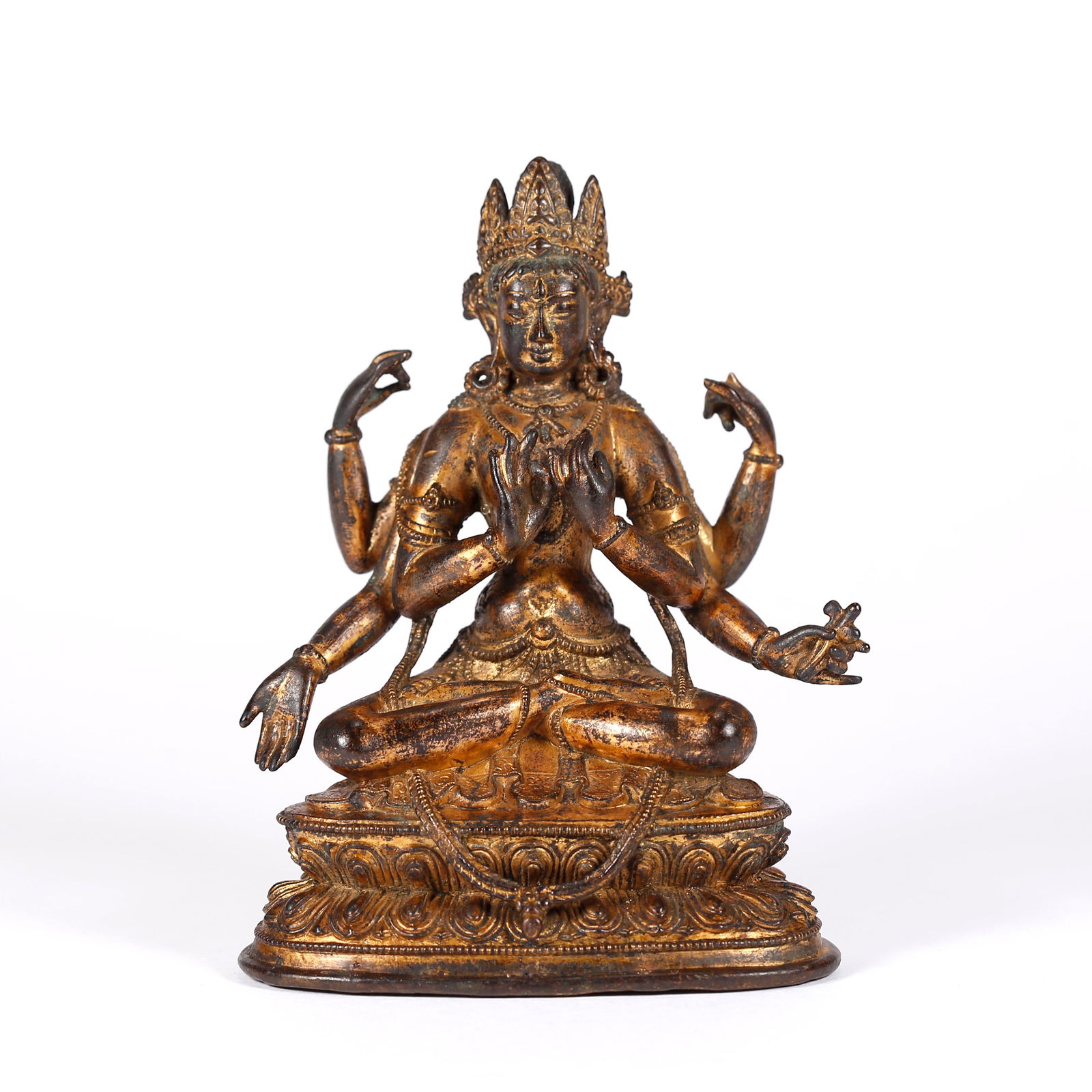A GILT BRONZE FOUR-ARMED AVALOKITESHVARA STATUE: Gilt Bronze Four-Armed Avalokiteshvara Statue