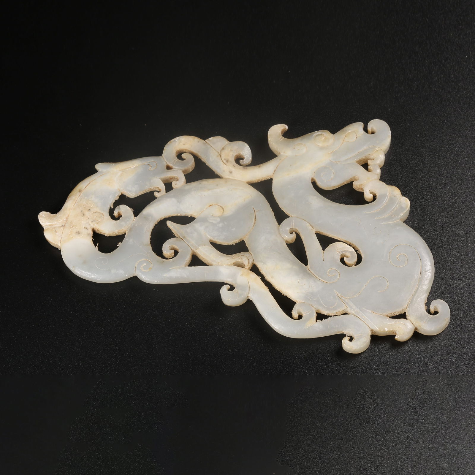 A ARCHAIC JADE PENDANT CARVED WITH DRAGON HEAD AND PHOENIX TAIL (1 of 8)