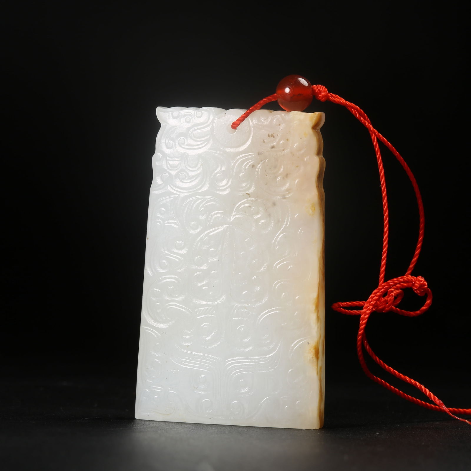 A ARCHAIC JADE BEAST-FACE MOTIF PENDANT (1 of 8)