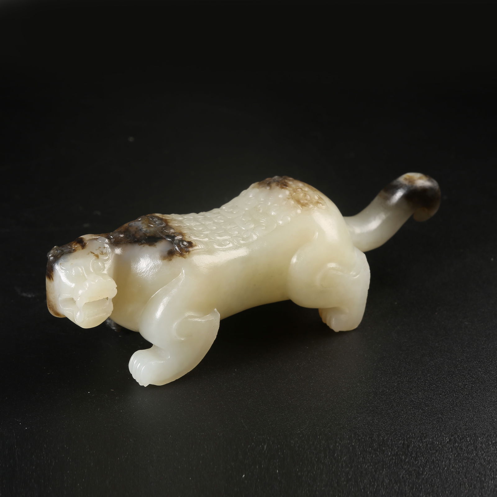 A ARCHAIC JADE AUSPICIOUS BEAST ORNAMENT (1 of 8)