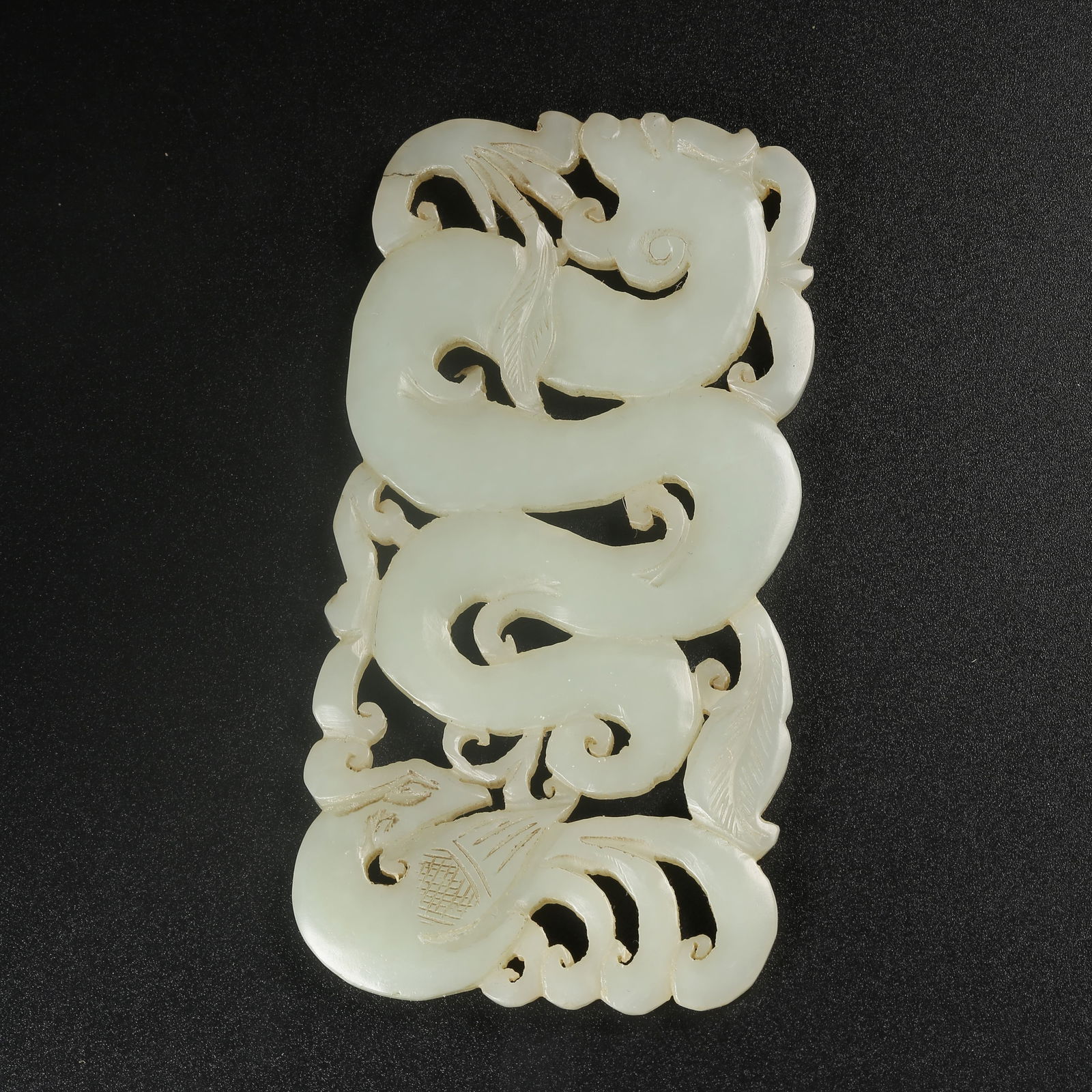 A HETIAN JADE DRAGON-AND-PHOENIX PENDANT (1 of 8)