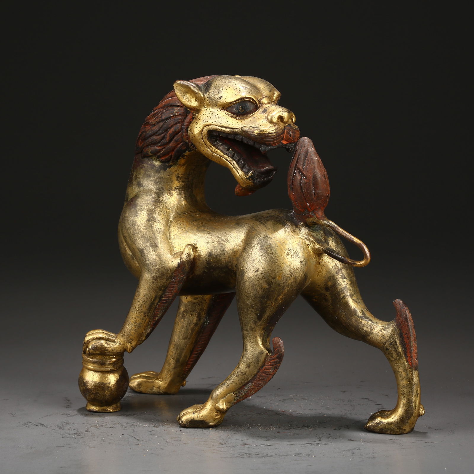 A GILT BRONZE SNOW MOUNTAIN LION: Gilt Bronze Snow Mountain Lion