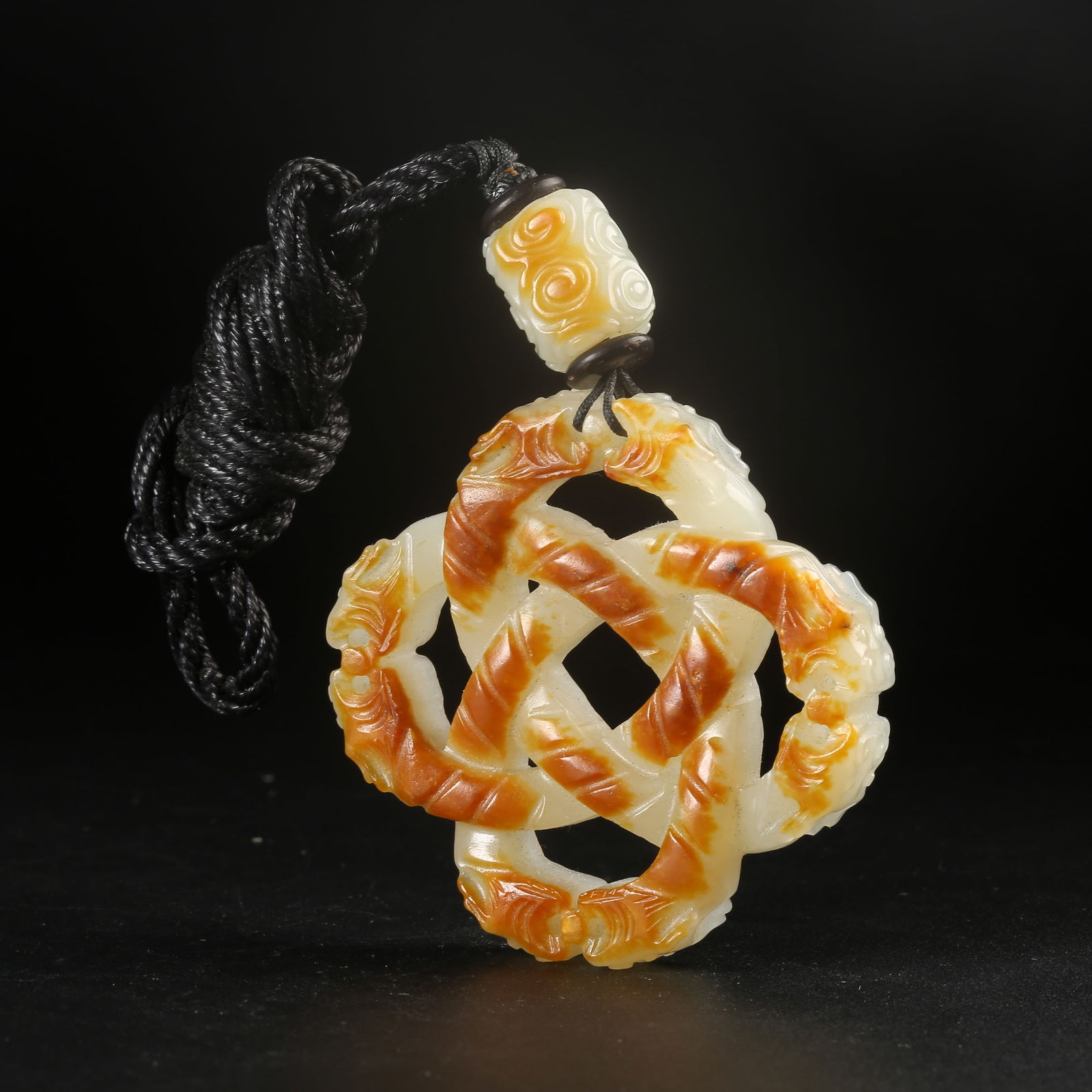 A HETIAN JADE DRAGON RING PENDANT (1 of 7)