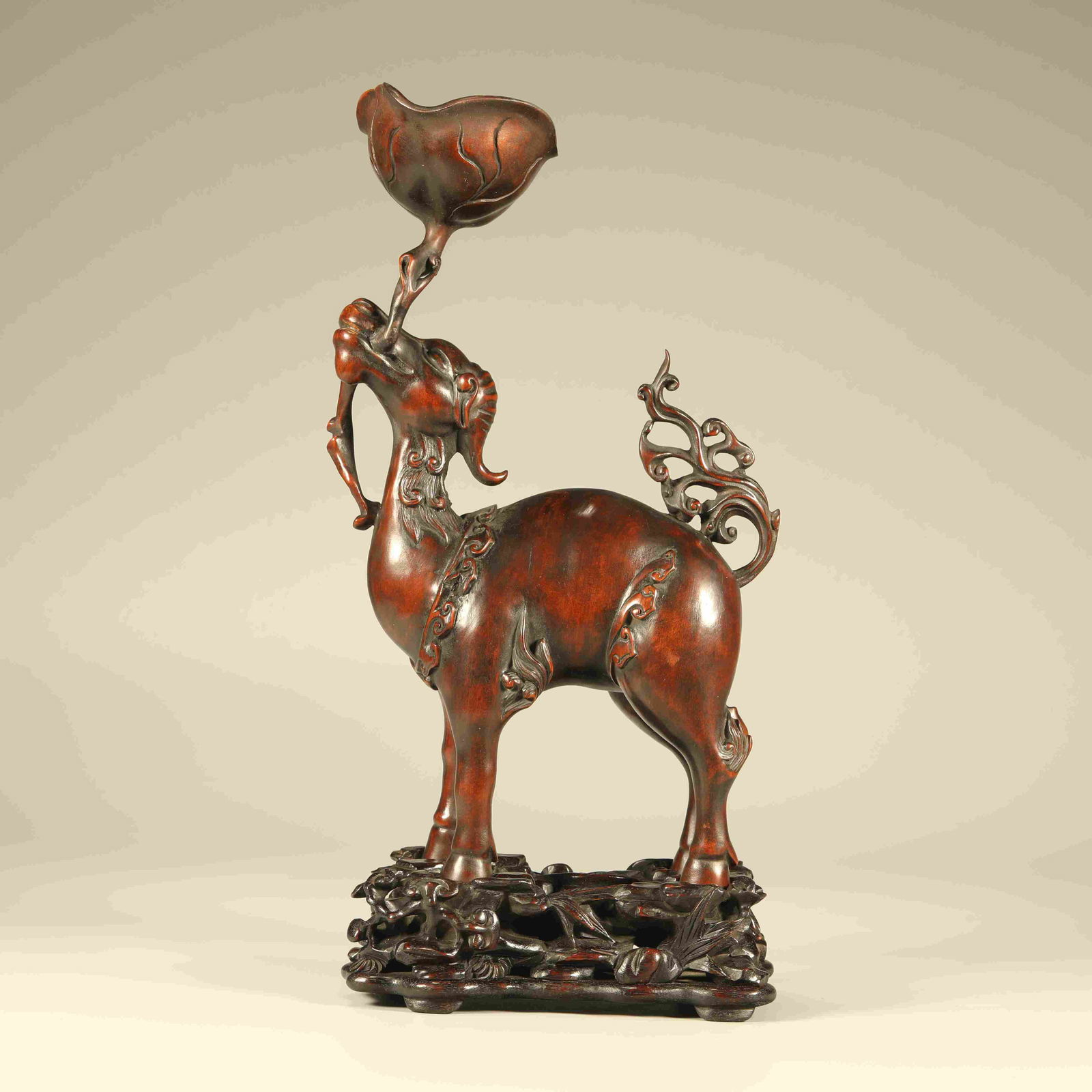 A BOXWOOD CARVING OF AN AUSPICIOUS BEAST (1 of 7)