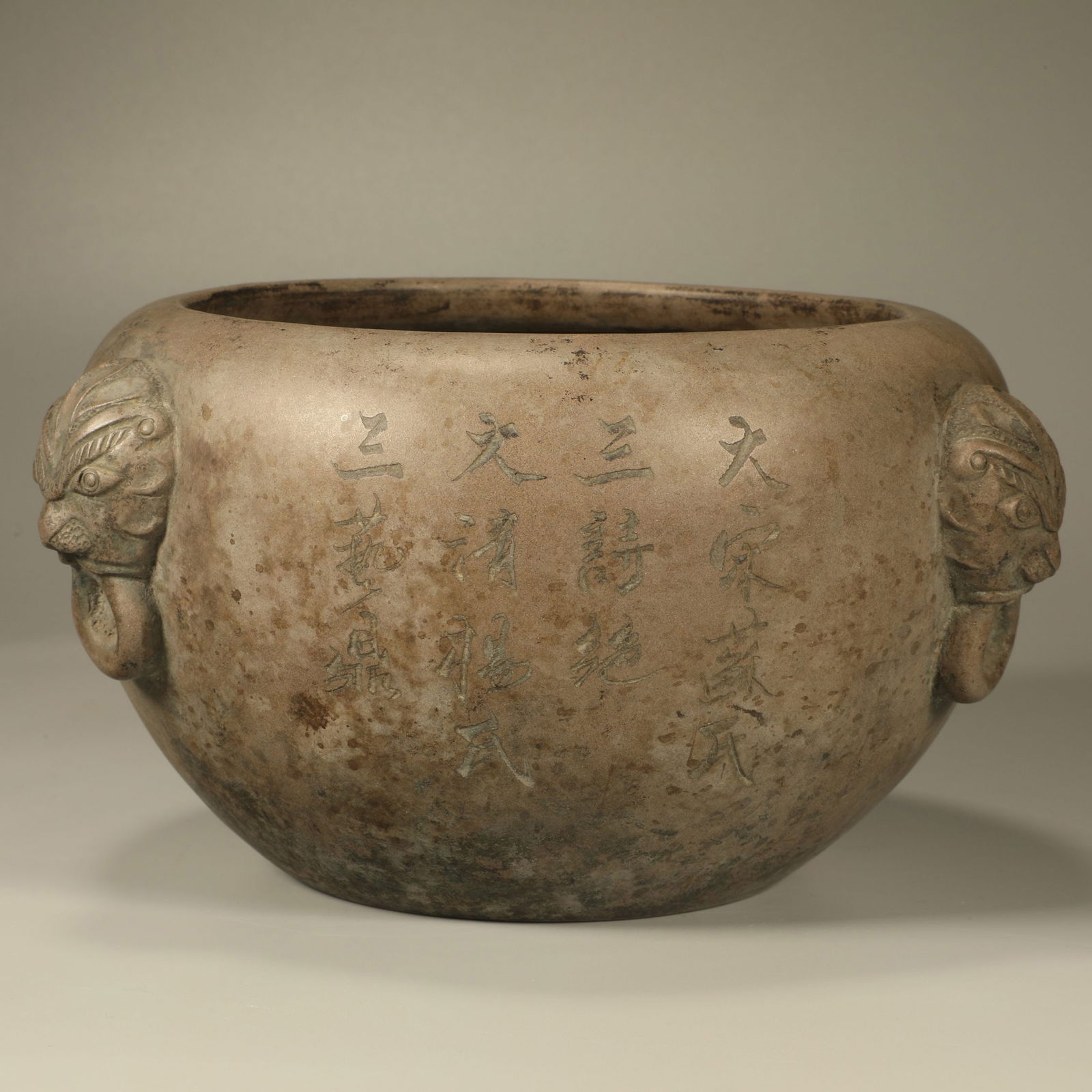 A YIXING STONEWARE BRUSH WASHER WITH POETIC INSCRIPTIONS AND LION-HEAD HANDLES (1 of 7)