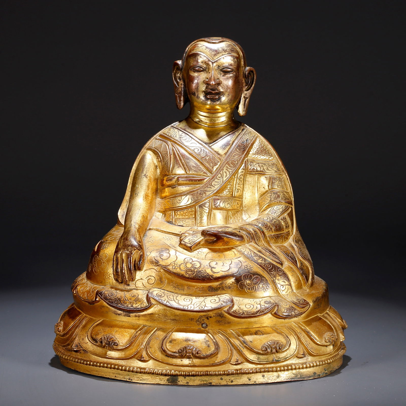 A GILT BRONZE LAMA FIGURE: Gilt Bronze Lama Figure