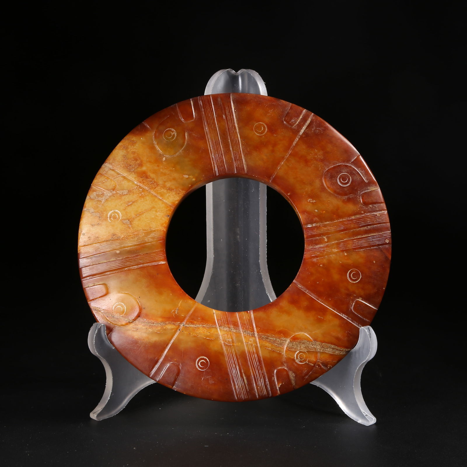 A ARCHAIC JADE DISC WITH DEITY FACE (1 of 10)