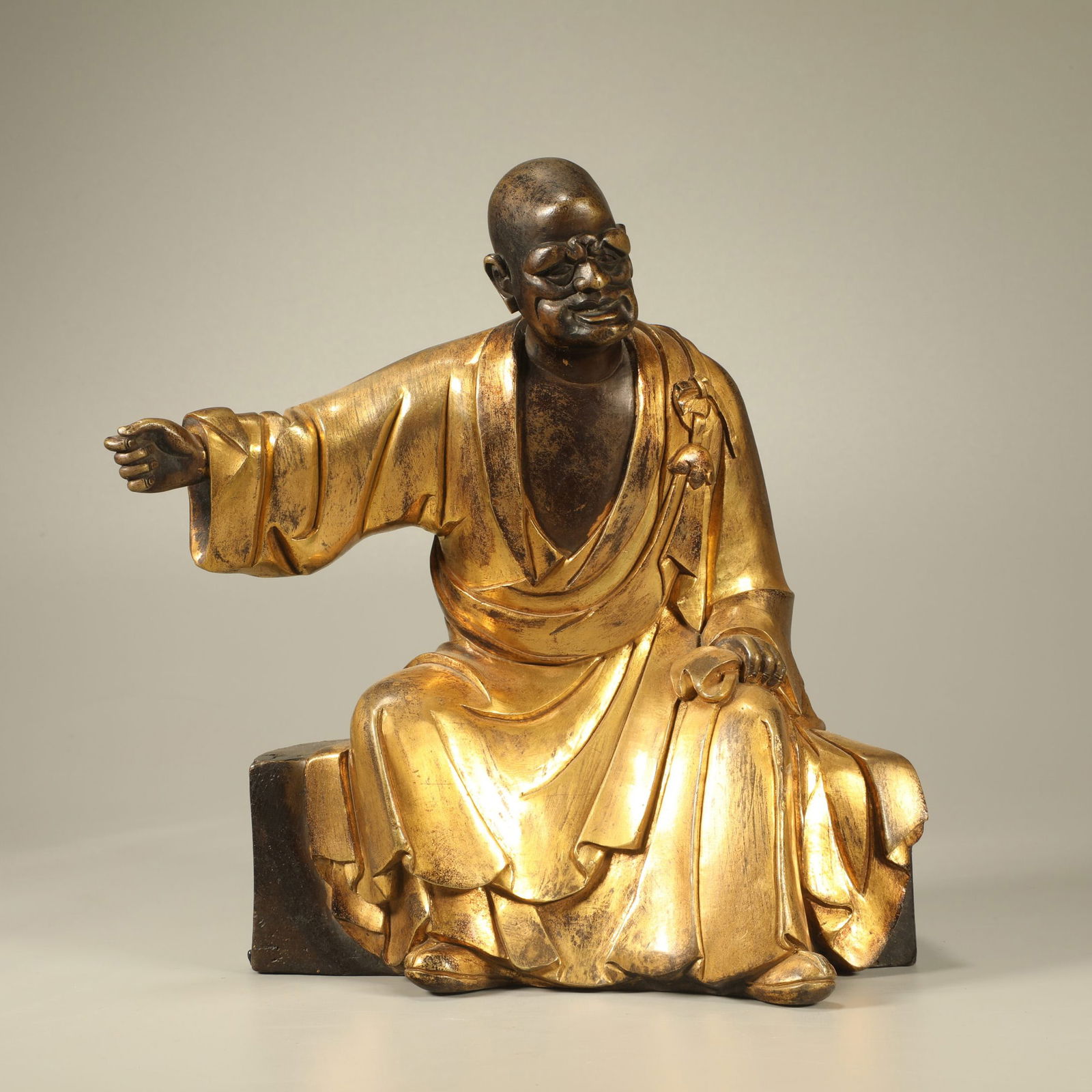 A GILT-BRONZE FIGURE OF AN ARHAT (1 of 6)