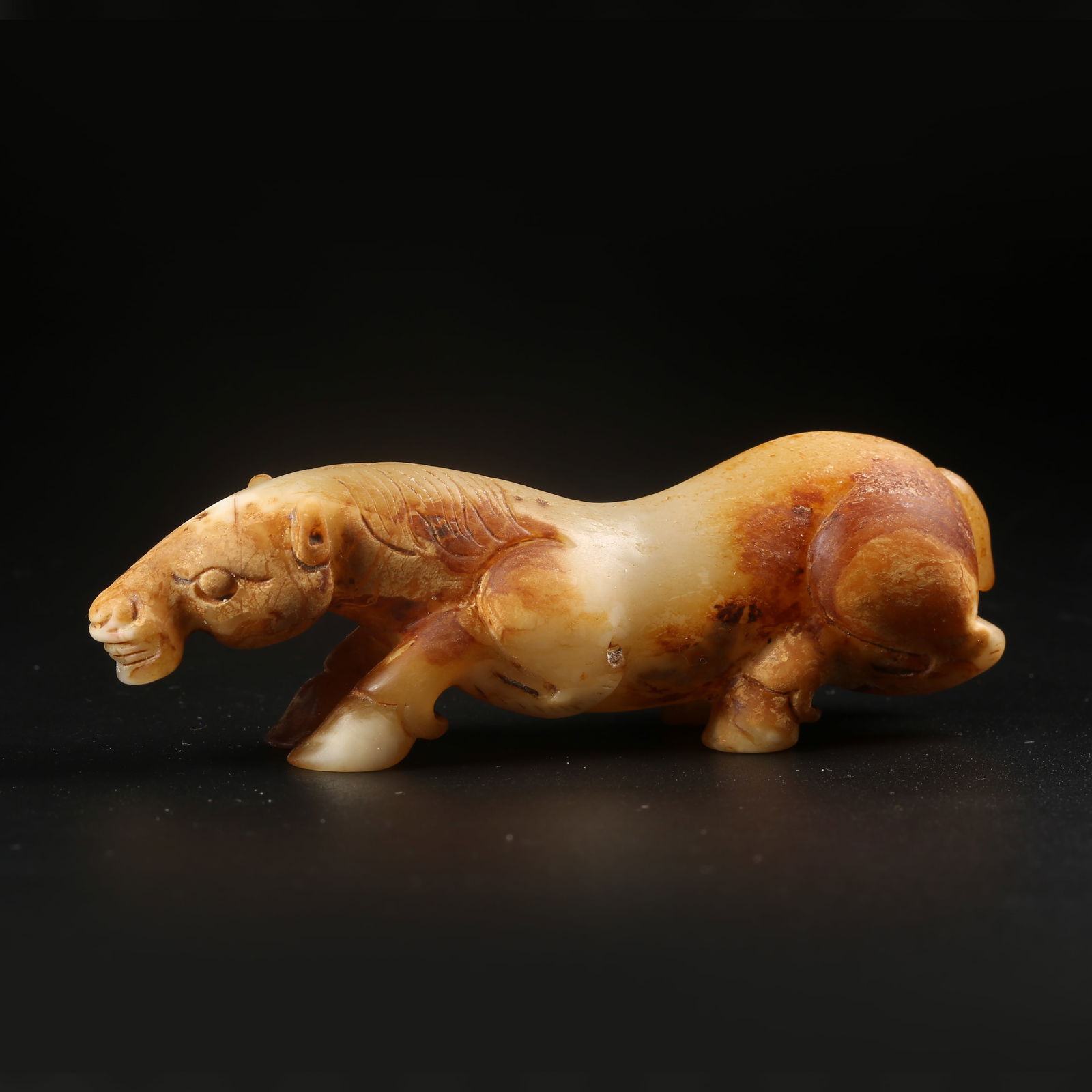 A ARCHAIC JADE RECUMBENT HORSE (1 of 8)