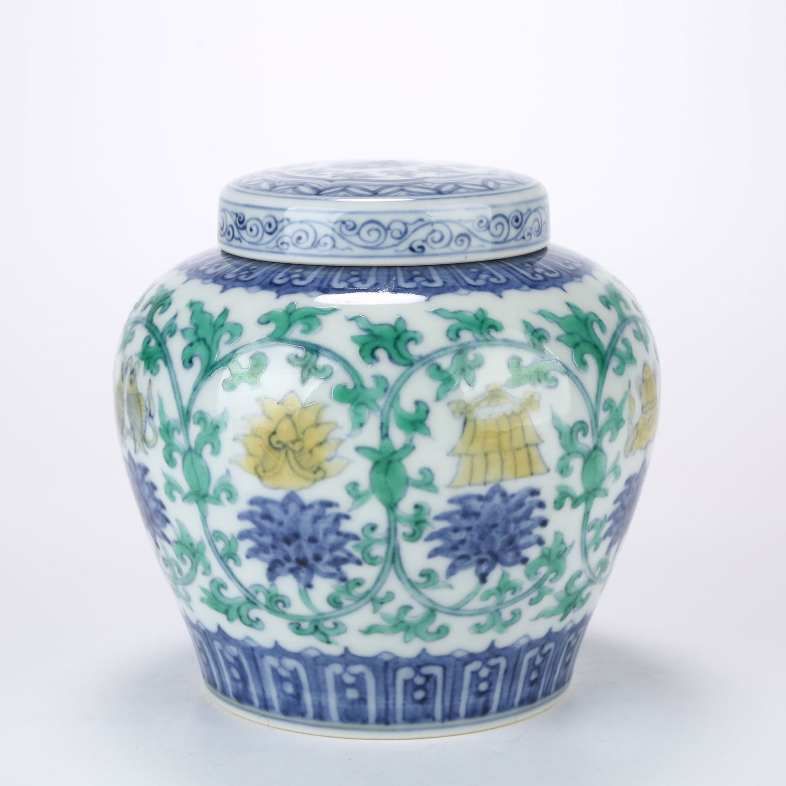 A DOUCAI "TIAN" CHARACTER JAR WITH SCROLLING LOTUS AND EIGHT AUSPICIOUS SYMBOLS (1 of 10)