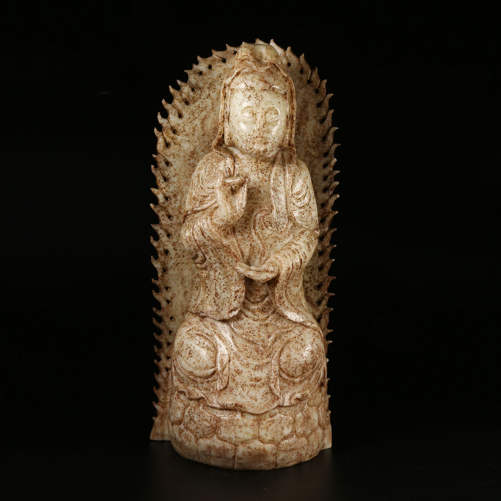 A ARCHAIC JADE SEATED GUANYIN FIGURE (1 of 8)