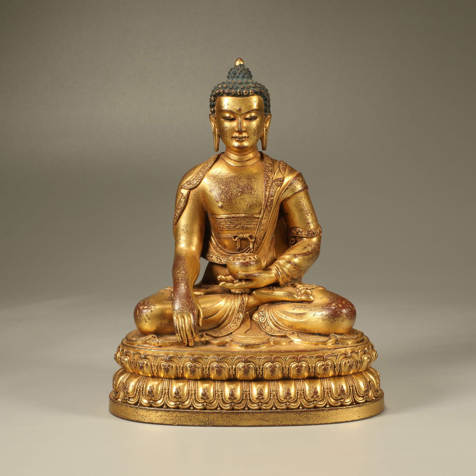 A GILT-BRONZE FIGURE OF SHAKYAMUNI BUDDHA (1 of 6)