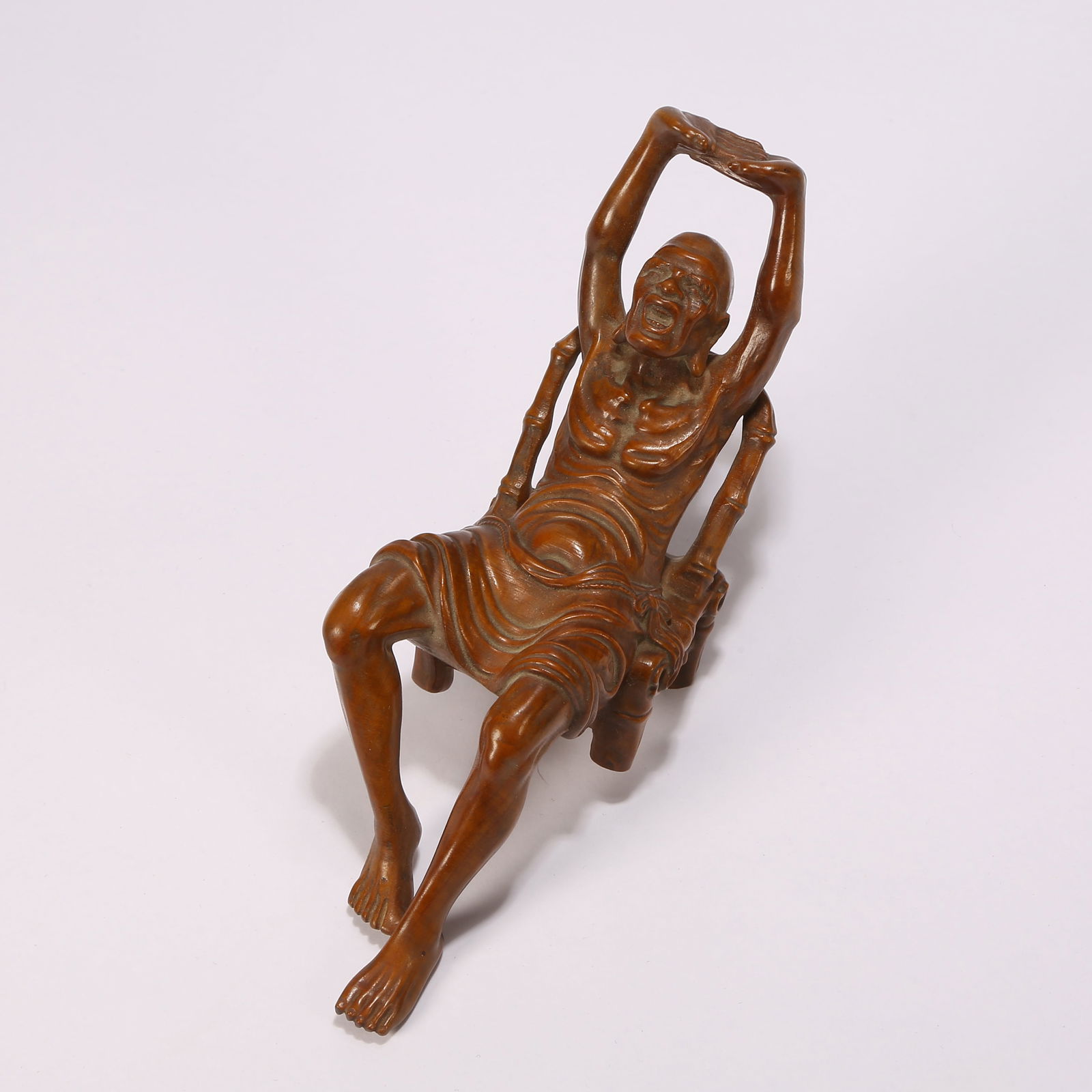 A BOXWOOD LUOHAN FIGURINE: Boxwood Luohan figurine
