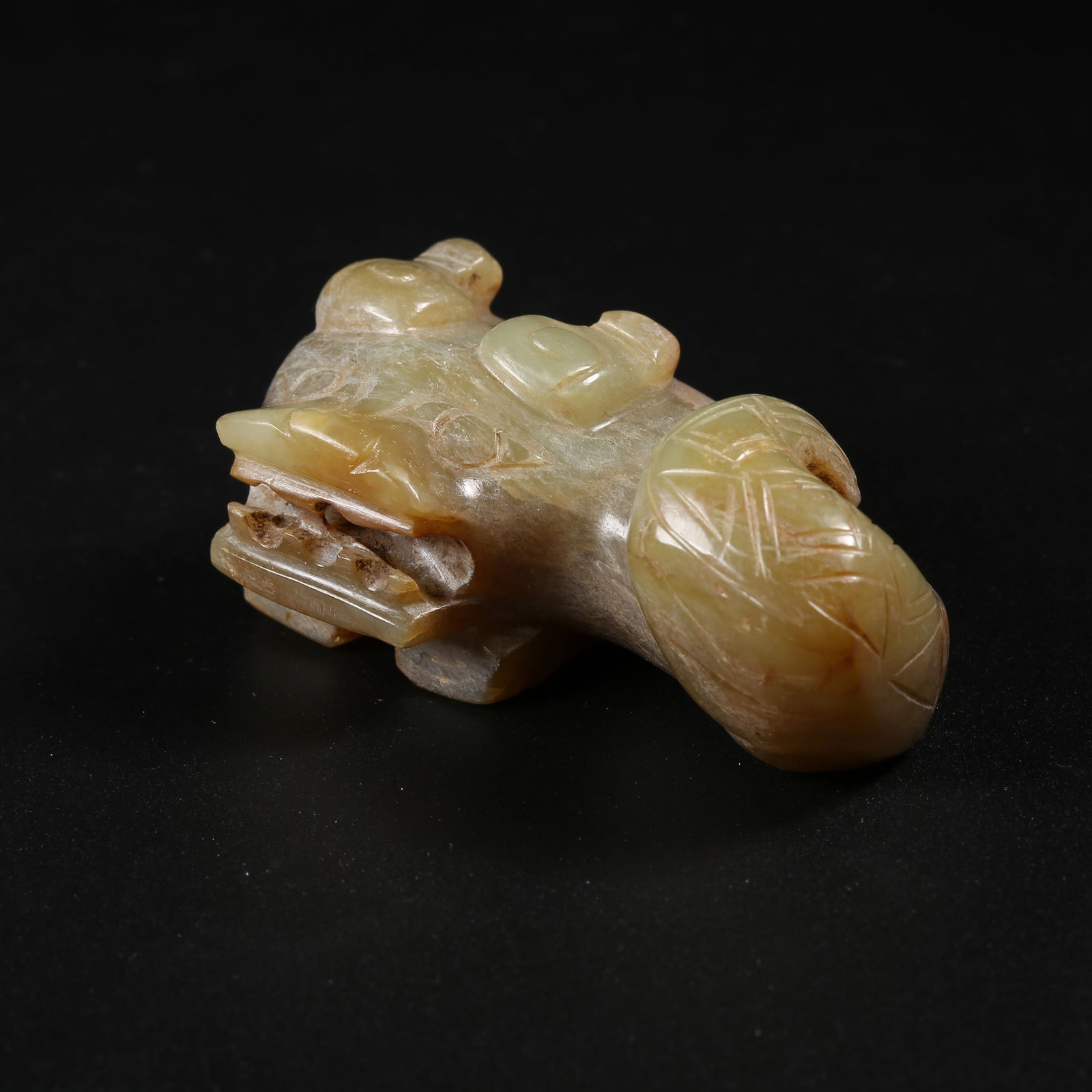A ARCHAIC JADE AUSPICIOUS BEAST FIGURINE (1 of 8)