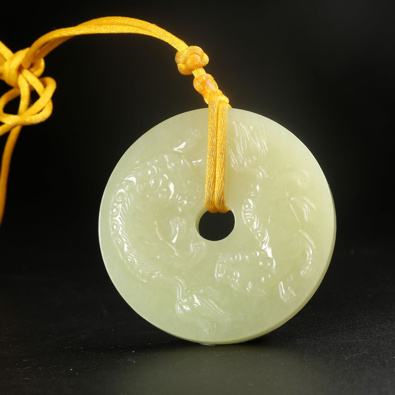 A HETIAN YELLOW JADE BI DISK WITH AUSPICIOUS BEAST MOTIF (1 of 7)