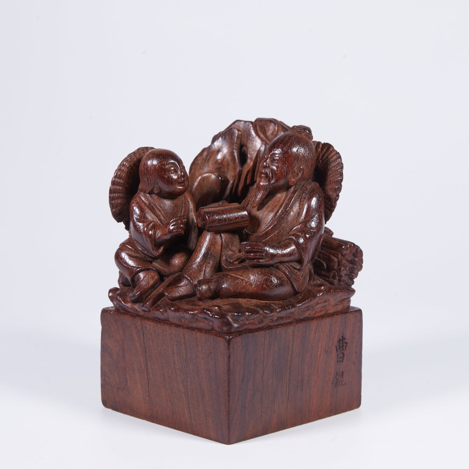 A WOOD-CARVED SEAL WITH FIGURAL MOTIF (1 of 7)
