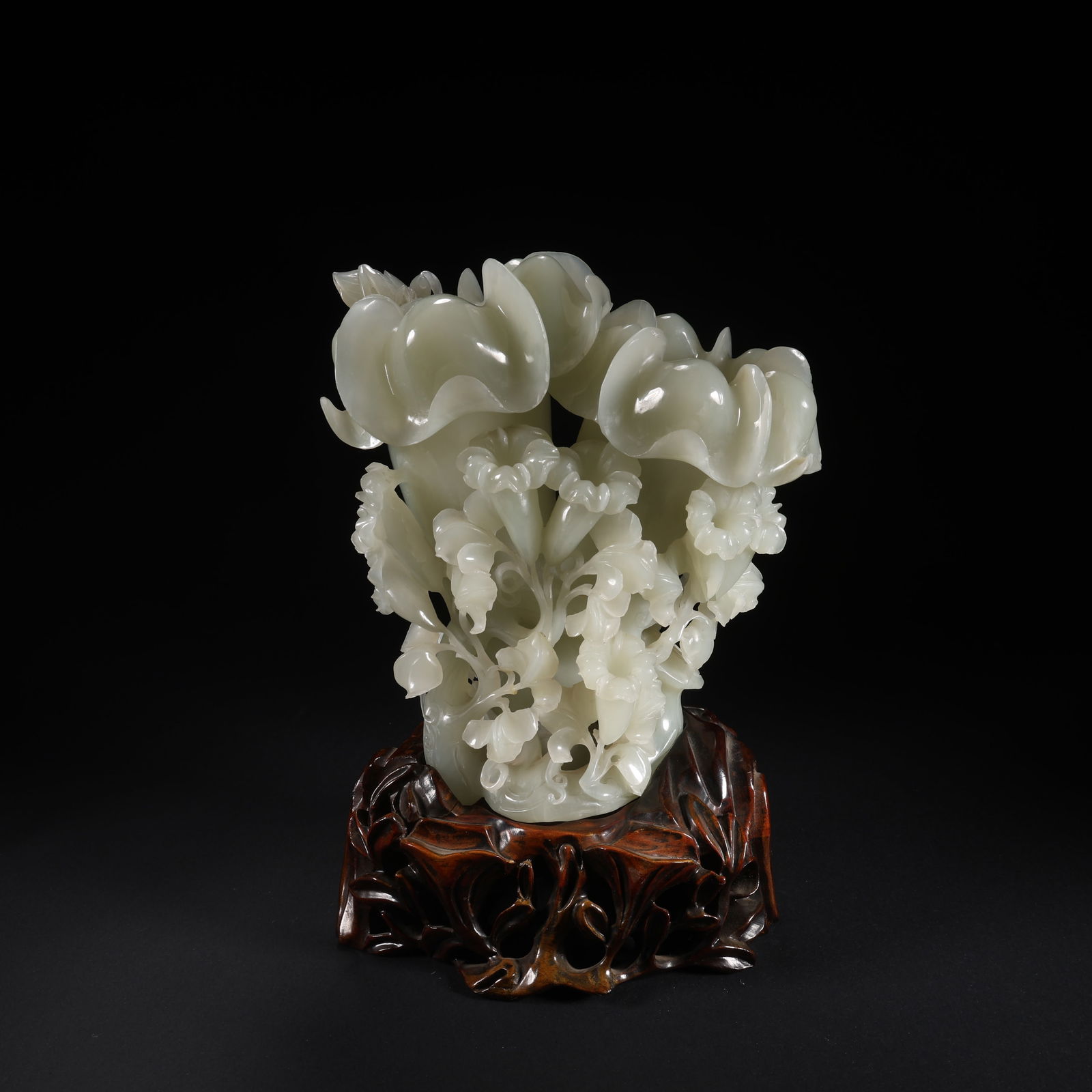 A HETIAN JADE TRUMPET FLOWER ON WOODEN STAND (1 of 9)