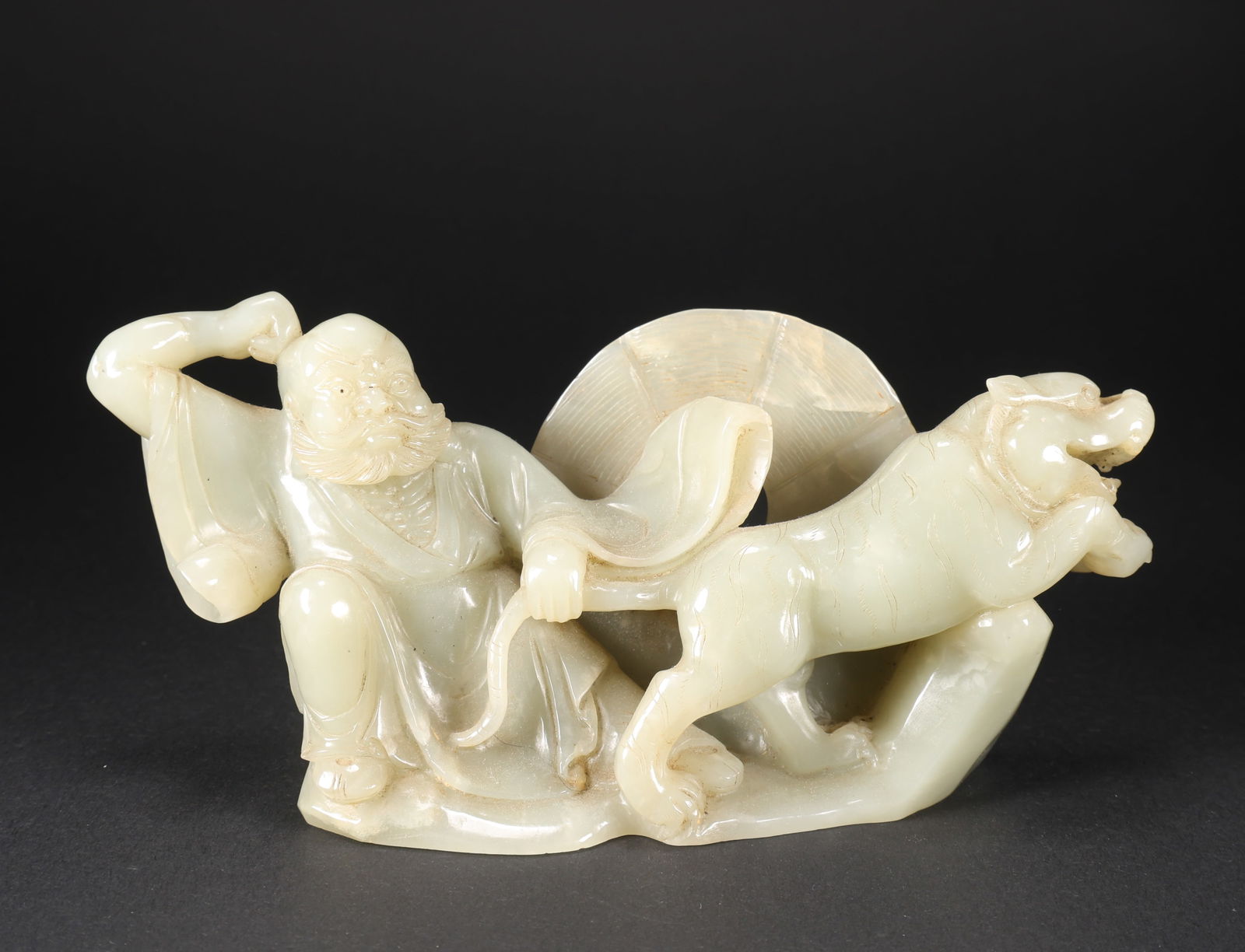 A HETIAN JADE RECLINING TIGER ARHAT (1 of 9)