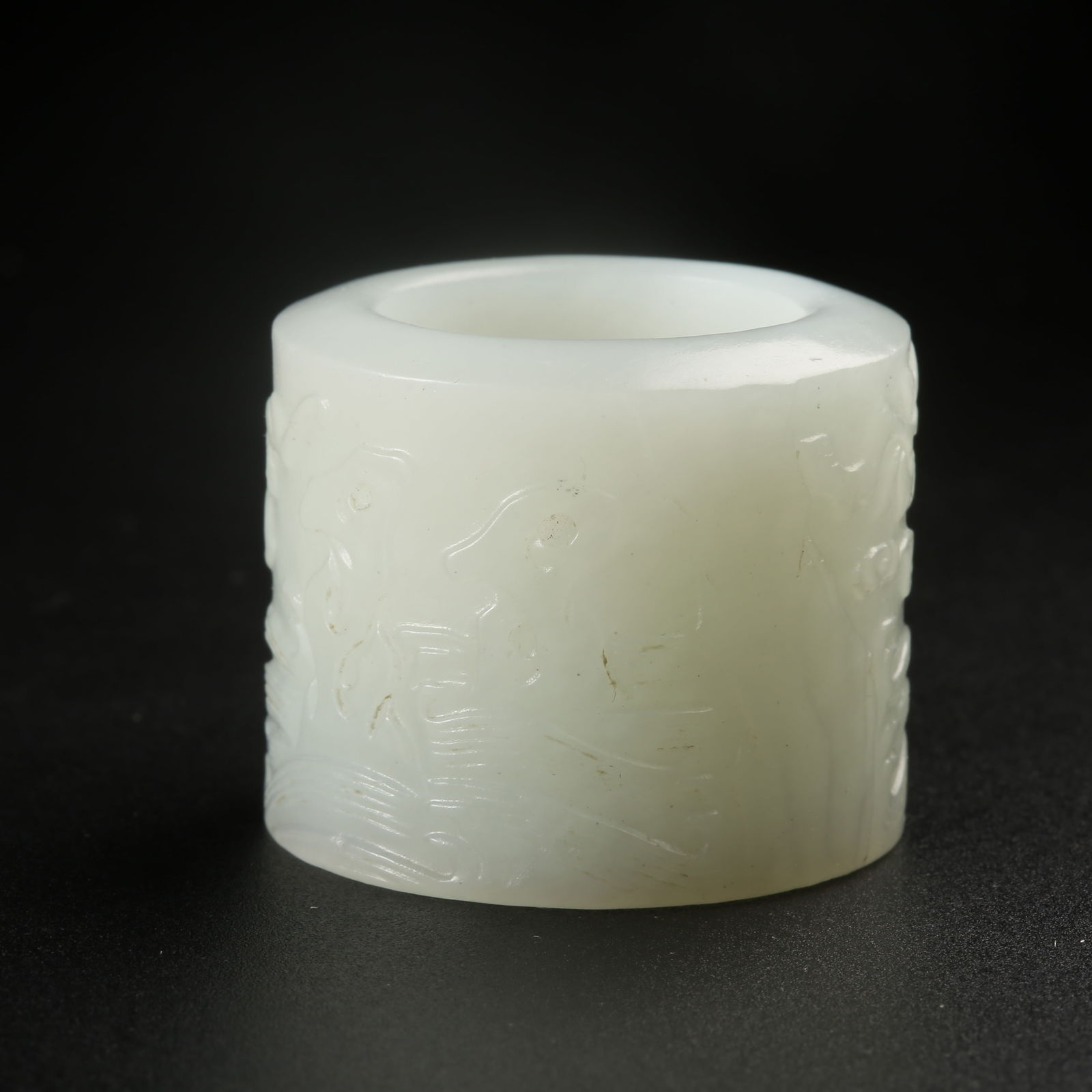 A HETIAN WHITE JADE THUMB RING WITH DONG-SHI FLOWER MOTIF (1 of 9)