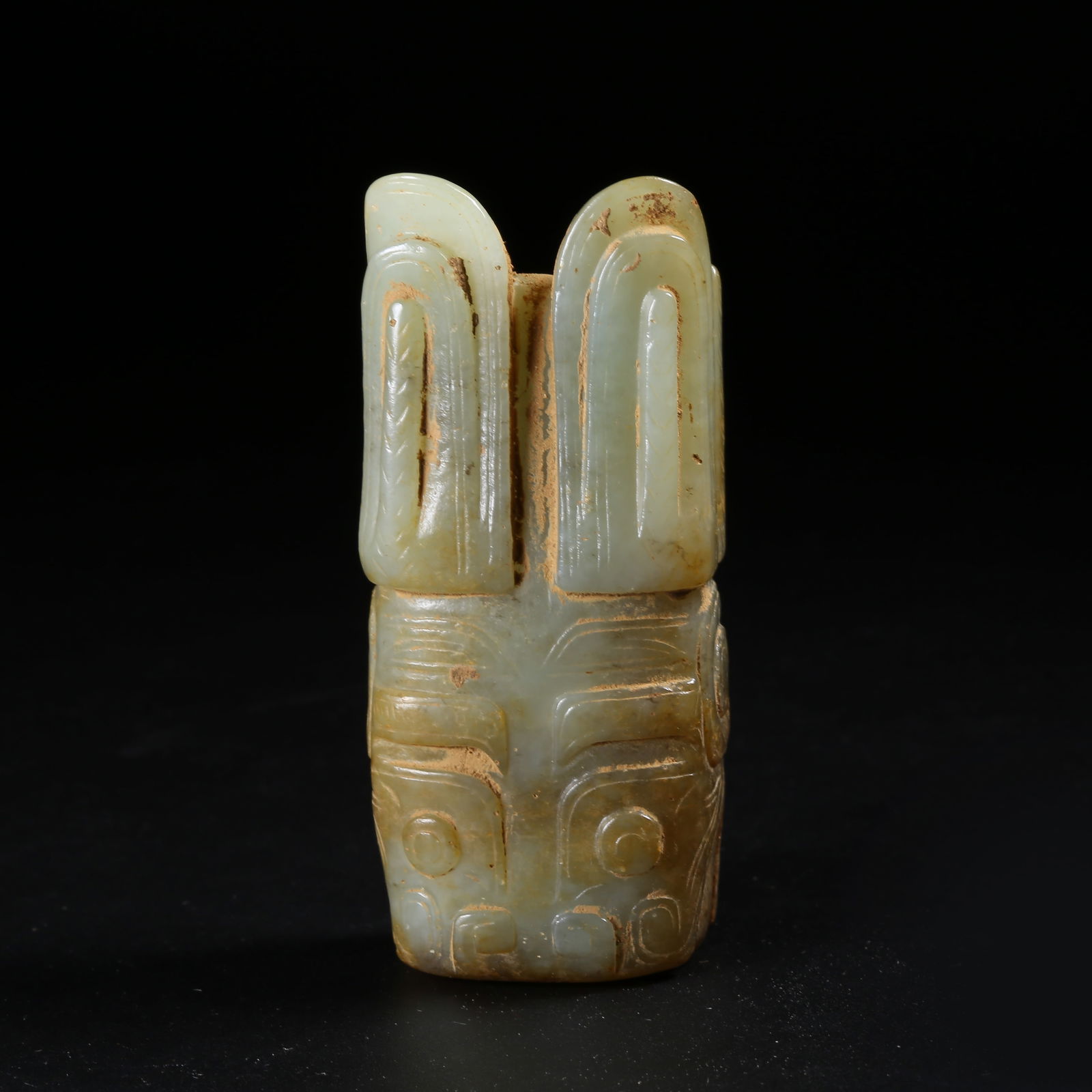 A ARCHAIC JADE DEITY FIGURE (1 of 8)